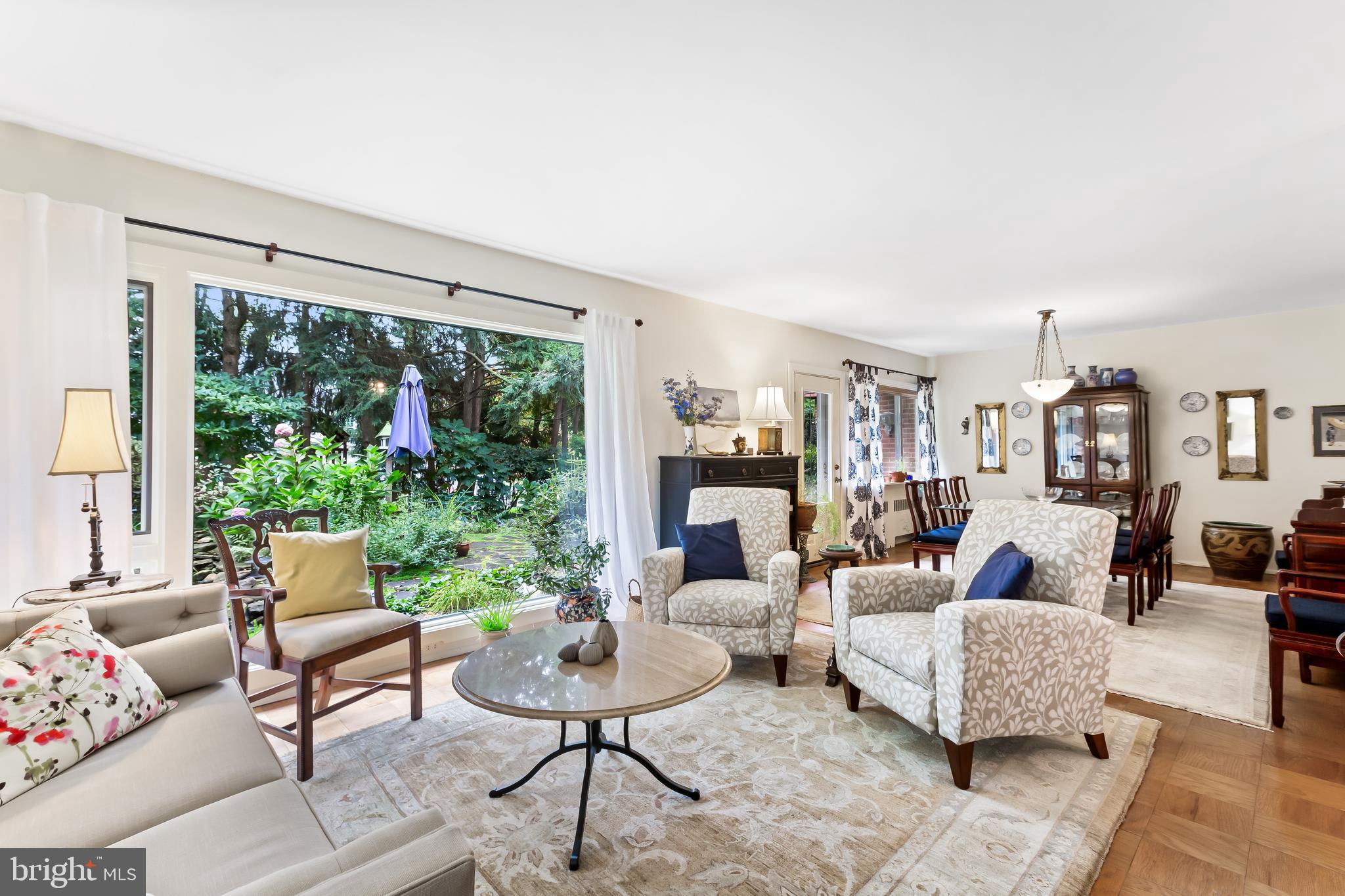 This is a one-of-a-kind condo that will truly blow you away. This two story unit has the feel of a townhome with its many amenities and features, most striking of which is the huge double pane living room picture window that overlooks the back yard with a truly Zen water garden – Giverny in Baltimore!  In addition, the living room has a welcoming fireplace, and it leads on to the dining room that also overlooks the back garden and generously sized patio.  A gourmet kitchen, first floor powder room and separate entry hall finish off the great first floor.  The second floor has 3 generously sized bedrooms and a separate hall bathroom and powder room.  This gem of a unit is tucked away from the hustle and bustle of the city, yet is conveniently located close to Towson, Roland Park, Mt. Washington Village and I83 and the beltway.