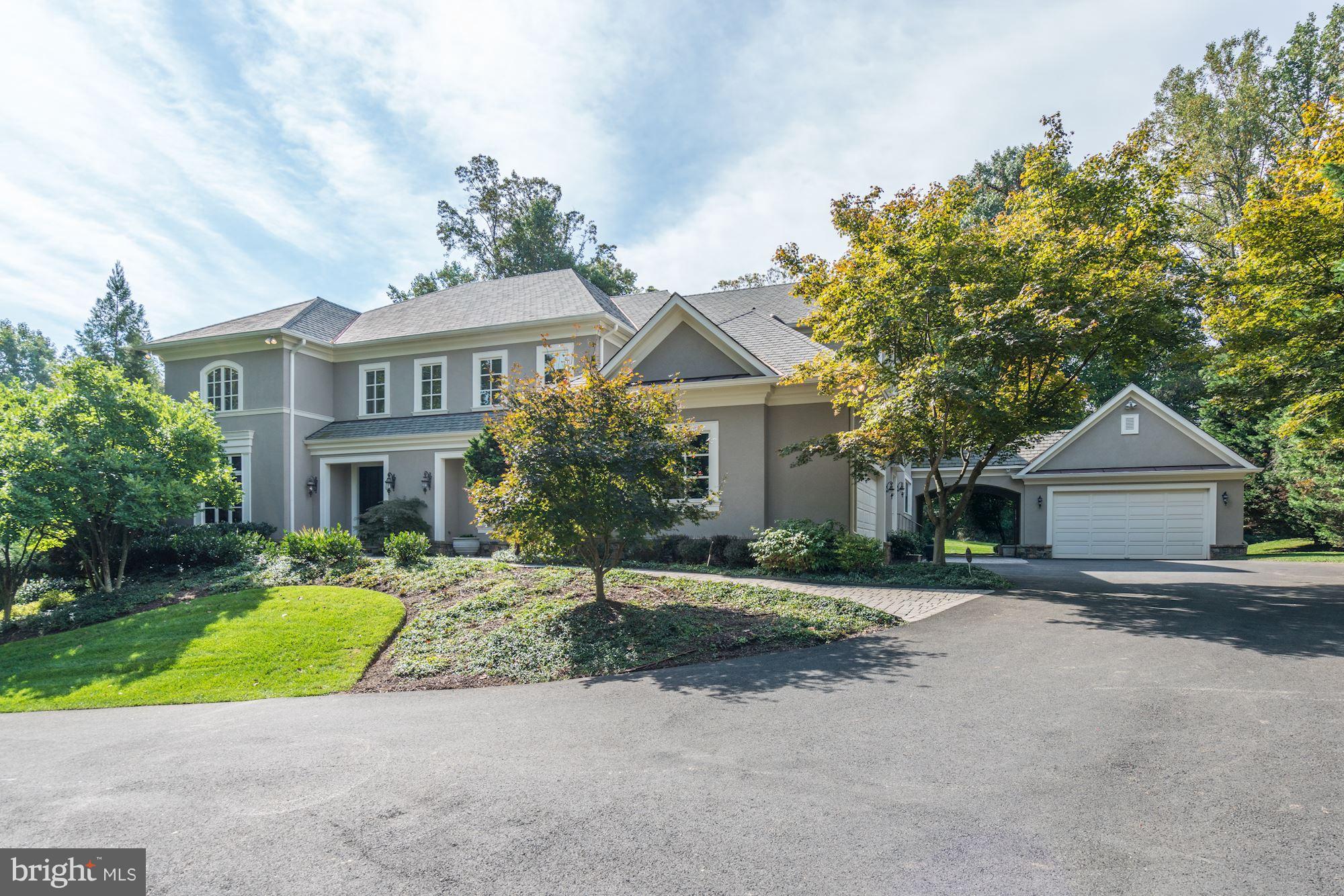 Spectacular hill top stone & traditional stucco home of uncompromising quality & serenity. Beautifully sited on private 1.7 ac lot w/ imposing curved drive. Grand entry into 2 story gallery w/ balustrade surround, embassy sized DR, gour kit w/ wet bar, butler's pantry & breakfast room. Main lvl bedroom, grand room and library. TWO 2 car garages! Fab MBR, his/her walk in closets & baths. See tours!