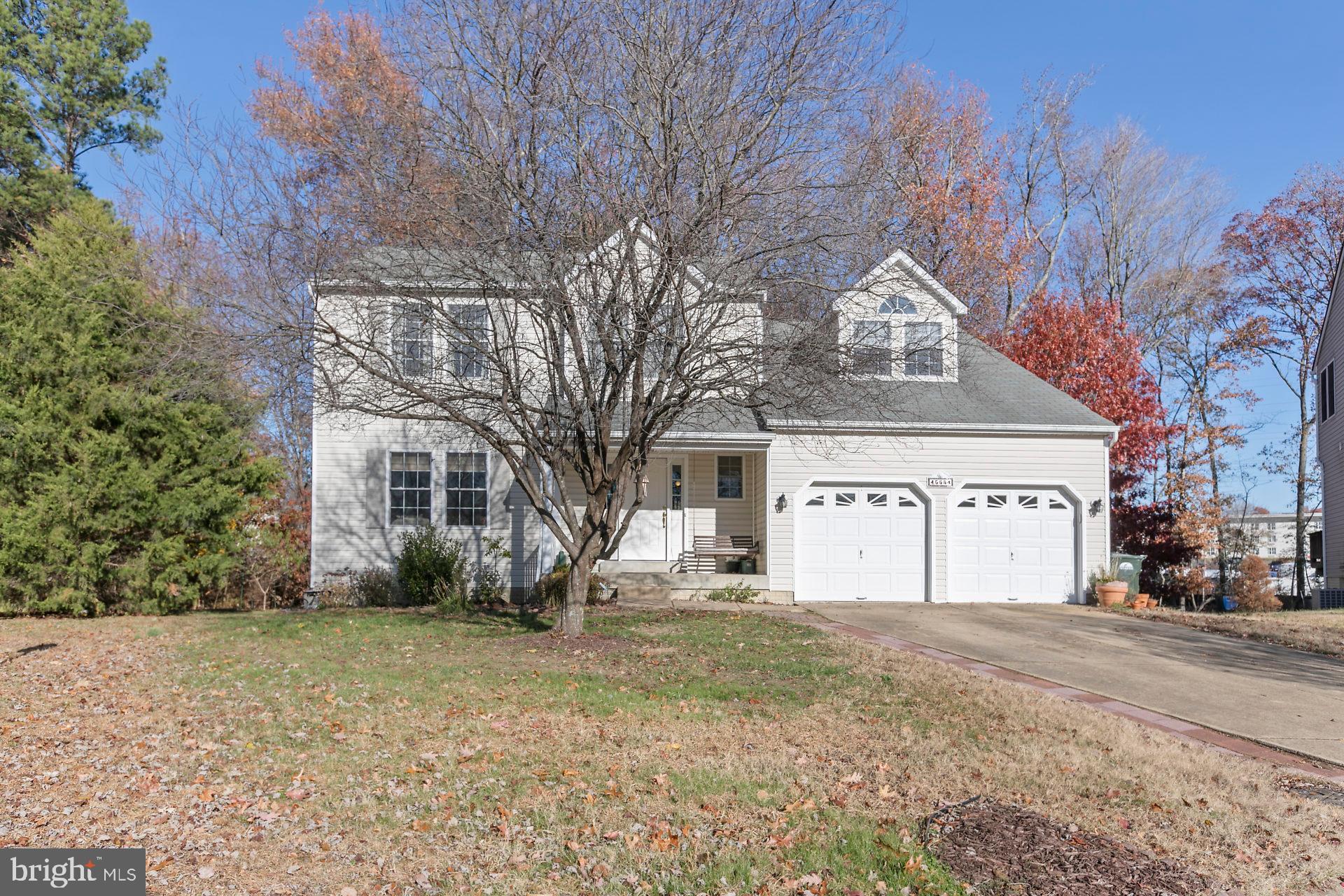 Come home to this fantastic 4 bedroom, 3 1/2 bath home with a full finished basement apartment and workshop!!! Approximately 3400 finished square feet...what a value at this price!   Enjoy breakfast in your cheerful sunroom and cooking out on the cozy deck and patio.  Conveniently located to shopping, schools and Pax River NAS.  Located on a private culdesac which backs to woods with the community pool right out your front door!  Fresh paint, new carpet and new  flooring makes this home move-in ready!  Come see your new home today!!
