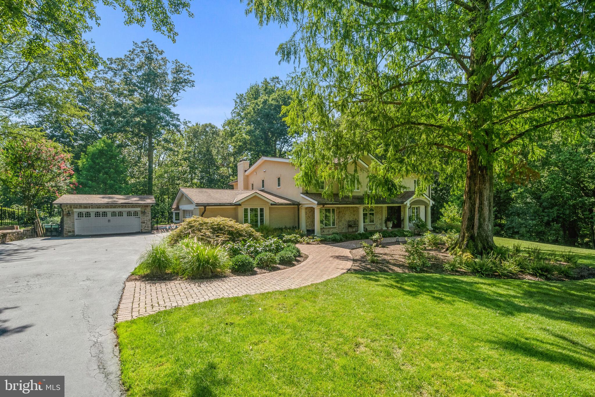 Sprawling, private estate on over two acres in sought after Vienna!  This home underwent a complete renovation and expansion by award winning architect Thomas French in 2012.  Italian villa style exterior features stone and stucco with extensive hardscaping.  The entire two acres have been professionally landscaped by Hidden Lane. A gorgeous pool, with separate pool house, firepit,  and endless outdoor entertaining spaces creates  a vacation atmosphere at home.  This incredible home welcomes you with 20 foot ceilings in the living and dining rooms featuring dual arched mahogany doorways opening to a pergola patio overlooking the private backyard oasis.   Incredible kitchen with arched stone range hood, Palladian windows, custom tile and down lit glass front cabinetry.  Nothing was overlooked: double all ovens, built in microwave, pot filler, appliance garage, trash compactor, temperature controlled wine refrigerator, 36” cast iron farmhouse sink, massive center island with beautiful Kohler prep sink and seating.  Large family room with wood burning fireplace overlooks the gorgeous pool and outdoor entertaining space.  Large bedroom with window seat and en suite full bath tucked away on main level.   Private study.  Upstairs features an indoor balcony with custom wrought iron railings.  Large primary suite with a wall of Palladian windows, two walk in closets and lovely bath with dual vanities, soaking tub and separate shower.  Laundry shoot from primary bath to laundry room.  There are three additional bedrooms with vaulted tongue and groove ceilings and a large secondary bathroom. The lower level has a walk out rec room with wood burning fireplace, gym area with rubber flooring, bedroom and full bath.  There is a temperature controlled wine cellar and tasting room with existing storage for 450 bottles and room for expanded storage.  The cellar has a stone floor and rough in for sink.  Huge unfinished storage room with shelving.  Two car garage with EV charging.  The separate, 320 square foot, pool house features a charming front porch and arched doorways lading to a bedroom, bathroom and two car garage.  Could be used as a separate living space on the property. Professional landscaping includes low-maintenance and deer resistant plants.  Roses, peonies, hydrangea, oriental lilies and Astilbe provide fresh cut flowers in your home from May through September.  30,000 gallon pool completely renovated in 2023.  Incredible location with close access to Tysons, Metro, Dulles Airport and all major commuting routes.  Sought after school pyramid is Colvin Run / Cooper / Langley.