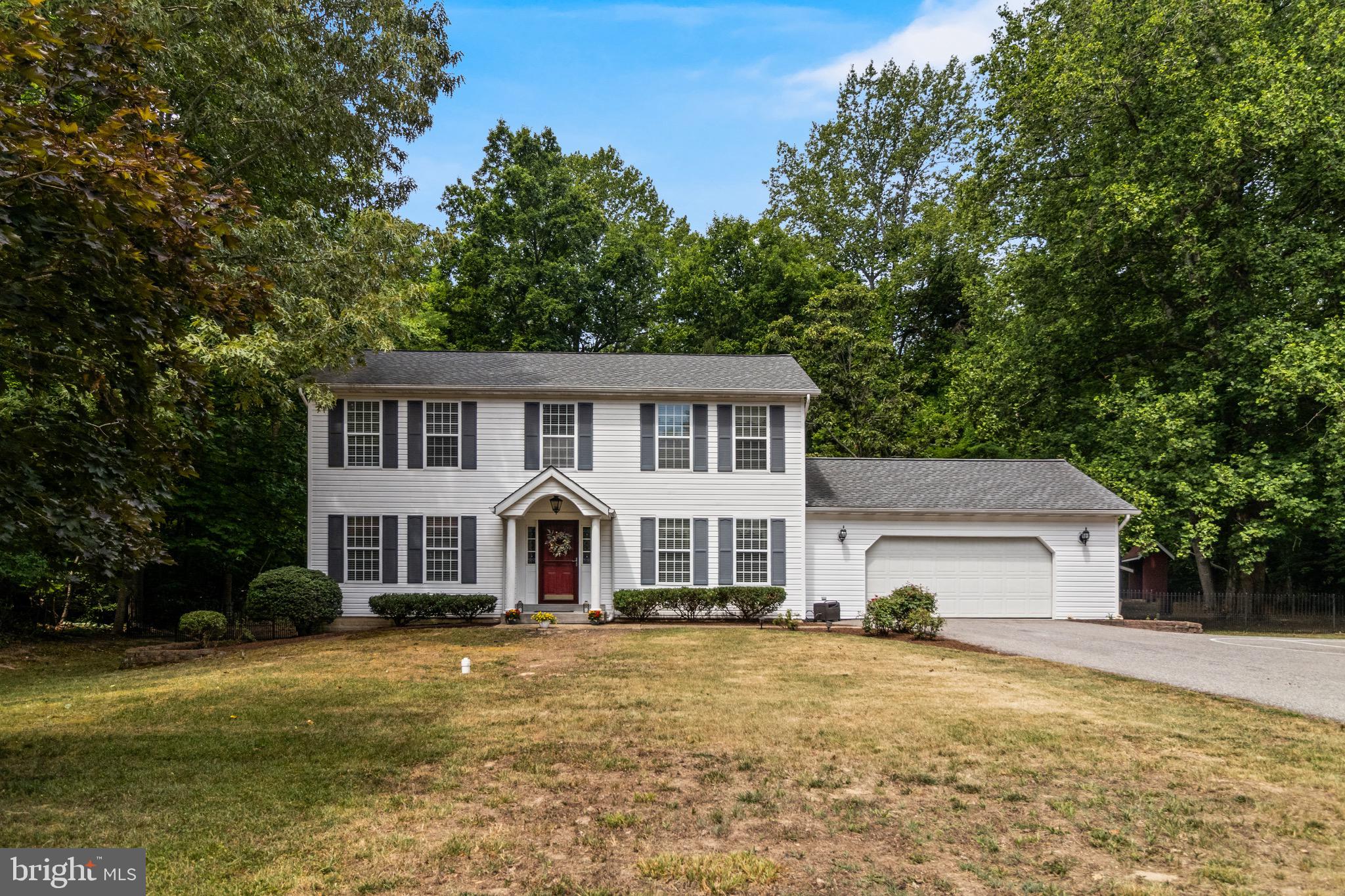 Located in the sought-after Mutual Elementary School district, this beautifully maintained 4-bedroom, 3.5-bath home offers the perfect blend of comfort, space, and privacy. Nestled on a private 1-acre lot surrounded by mature trees, you’ll enjoy a peaceful setting while remaining just minutes from shopping, dining, parks, and everyday conveniences, and only 20 minutes from beautiful Solomons Island.

The main level features plank flooring and a welcoming family room with a wood stove, creating the perfect spot to gather on cooler evenings. Sliding glass doors lead to the backyard, seamlessly connecting indoor and outdoor living. The kitchen offers table space and a bay window overlooking the scenic rear yard. An additional room currently could be used as a formal dining room, home office, playroom, or additional living space.

The mostly finished lower level adds valuable living space and includes a full bathroom, making it ideal for entertaining, guests, a home gym, or recreation area. Additional unfinished basement space and a floored attic provide excellent storage options, while a French drain system offers added peace of mind.

Upstairs, the spacious owner’s suite features a walk-in closet and dual vanities. Three additional bedrooms and another full bath provide plenty of room for family and guests.

Outside, enjoy the privacy of the tree-lined backyard from the large patio, perfect for entertaining, grilling, or simply relaxing. An oversized side-entry two-car garage with abundant shelving and a large storage shed offer plenty of room for vehicles, tools, and hobbies.

Additional updates include a new roof (2021) and HVAC system (2022), which was recently serviced for added peace of mind. The outdoor patio set, featuring an oblong table and six chairs, conveys with the property, along with the children’s play equipment, making it easy to start enjoying the outdoor space from day one.
