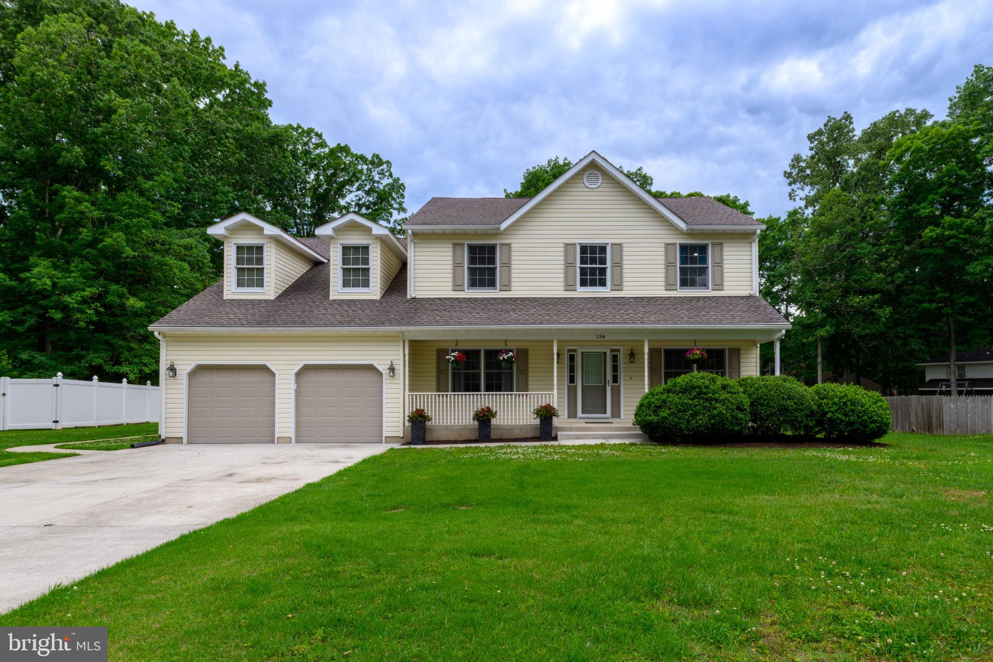 Welcome to 134 Red Oak Drive in Dover's established Hidden Oaks community! Situated on a spacious half-acre lot, this beautifully maintained two-story home offers the space, flexibility, and convenience that today's buyers are searching for. Featuring 4 bedrooms and 2.5 bathrooms, this home provides over 2,600 square feet of comfortable living space, including a bright and inviting sunroom that is perfect for relaxing, entertaining, or enjoying views of the backyard year-round. The master bedroom is extremely spacious with lots of natural light, vaulted ceilings, walk in closet, and master bathroom with soaking tub, double vanities,  and separate shower. The thoughtful floor plan includes multiple living and dining areas, giving everyone room to spread out while still creating spaces to gather and connect.  Parking is often a challenge with newer homes, but not here. In addition to the attached two-car garage, this property offers parking for up to six vehicles, providing flexibility for guests, hobbies, or multi-vehicle households.  Conveniently located less than five minutes from Delaware State University, shopping, dining, and everyday amenities, this home combines the benefits of a spacious homesite with easy access to everything Dover has to offer.  If you've been searching for a home that delivers generous indoor living space, a large yard, abundant parking, and a location close to major conveniences, 134 Red Oak Drive deserves a spot at the top of your list. Schedule your private tour today and see all that this exceptional property has to offer!