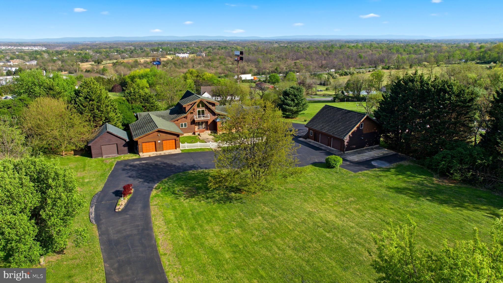 Luxury Lindal Cedar Estate | Nearly 6,000 Sq Ft | Indoor Pool | 2.57 Acres

Welcome to this extraordinary custom Lindal Cedar home, offering nearly 6,000 square feet of beautifully designed living space set on 2.57 private acres across two deeded lots. Enjoy the flexibility to sell, build, or preserve the additional lot for added privacy.

This one-of-a-kind estate features 3 spacious bedrooms and 4 full baths, with three fully finished levels designed for both everyday living and upscale entertaining. Soaring vaulted ceilings, a striking gas fireplace, and expansive windows frame stunning views from multiple living areas and extensive decking.

Resort-style amenities include:

Private indoor pool and hot tub room
Steam shower for spa-like relaxation
Multiple game rooms, recreation rooms, and living spaces
Separate efficiency apartment above the garage with full bath—ideal for guests, in-laws, or rental income

Car collectors and outdoor enthusiasts will love the 6-car garage, including space for an RV.

Constructed with top-of-the-line materials, this home features a concrete tile roof, copper roofing accents, and quality craftsmanship throughout. Comfort is ensured with propane furnaces and central air, all managed by 6-zone climate control.

Ready for your custom finishes, this property presents a rare opportunity to create your dream luxury retreat in an already exceptional structure.