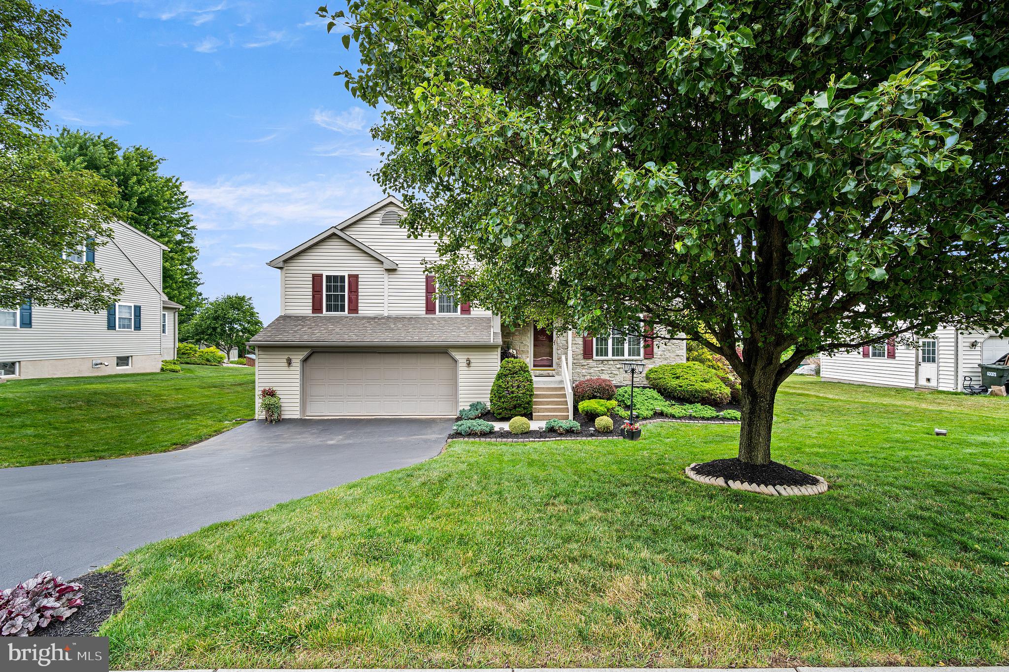 Welcome to 349 Farm View Drive in East Earl Township, located in the Eastern Lancaster County School District.  4 bedrooms, 2.5 baths, 2 car garage! This exceptionally well-maintained split-level home offers outstanding curb appeal with its attractive stone and vinyl exterior, mature landscaping, and low-maintenance design.

Bright, airy, and filled with natural light, the open floor plan creates a warm and inviting atmosphere throughout. A welcoming foyer opens to a spacious living room featuring a dramatic vaulted ceiling that enhances the home's sense of space. The centrally located eat-in kitchen offers abundant oak cabinetry, kitchen island, generous counter space, and a bright dining area.

Adjacent to the kitchen is a standout sunroom featuring an electric fireplace, radiant floor heat, vinyl windows that open to welcome fresh air, and expansive views of the surrounding Lancaster County countryside and spectacular sunsets.

Upstairs, the home offers three generously sized bedrooms, each featuring a ceiling fan, plenty of closet space, and neutral décor. The primary suite includes a private bath with a double-bowl vanity, while an additional full hall bath serves the remaining bedrooms.

The lower level includes a spacious and comfortable family room that is ideal for entertaining with luxury vinyl flooring! The 4th bedroom is located on this level as well which could also serve as an home office.  A convenient laundry area and powder room are also located on this level along with walkout access to the patio and back yard. 

Outdoor features include a perfectly level, well-maintained backyard with vinyl post-and-rail fencing, a patio area, mature landscaping, and a large storage shed.

Additional highlights include public sewer, and low Lancaster County taxes of just $4,142 annually.

Conveniently located on a quiet side street with easy access to Route 322, New Holland, shopping, dining, and everyday amenities, this property reflects pride of ownership throughout.

Move-in ready and awaiting its next owner.