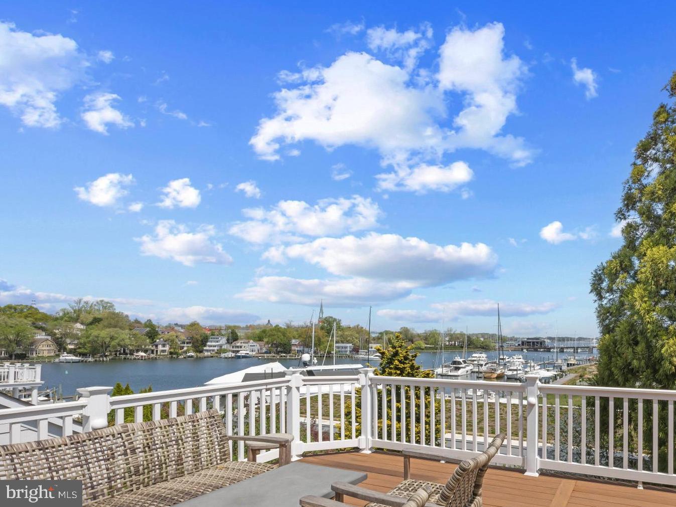 Experience the very best of the Eastport lifestyle, where sweeping views of Spa Creek, Historic Annapolis, and the Annapolis Harbor create an ever-changing backdrop to daily life. Thoughtfully designed to maximize its remarkable setting, the residence features a reverse floor plan, placing the main living spaces at the top level to fully capture the water views and vibrant harbor activity.

The heart of the home is an expansive, light-filled open floor plan where walls of windows and doors frame the water and seamlessly connect the interior to an oversized deck, an ideal setting for entertaining or quiet moments overlooking the Creek. The gourmet kitchen is both refined and functional, flowing effortlessly into the dining and living areas. Throughout the home, meticulous attention to detail is evident with rich hardwood flooring, upgraded lighting, and beautifully curated finishes.

Designed with flexibility and comfort in mind, the layout offers multiple living spaces, including an additional family room on the entry level, along with a thoughtfully arranged bedroom layout. The home features a luxurious primary suite complete with a cozy fireplace, and its own access to the extensive deck.  The entry level bedroom suite and additional well-appointed bedrooms and bath comfortably accommodate family and guests. The unfinished lower level with walkout stairs to the backyard offers exceptional potential for future living space, recreation, or storage, allowing the next owner to tailor the home to their specific needs.

Outdoor living is equally compelling, with spacious entertaining area and multiple vantage points to take in the water views and surroundings. The covered deck, grass yard and stone paved sitting areas allow for enjoying the setting all year long.

This property is in the perfect location to stroll the artful and nautical streets to amenities like; five-star restaurants, pubs and street-end parks with hidden treasures. Not to mention you are merely steps away from downtown Annapolis and Naval Academy by either walking across the Spa Creek drawbridge or motoring in a water taxi. You are also close to some of the Bay's best cruising and fishing areas. Attractive destinations such as Baltimore's Inner Harbor, St. Michael's, Oxford, and Solomon's Island are only a short cruise away. Annapolis/Eastport offers the perfect balance of small-town charm and big world sophistication. Located just 5 miles to Rt. 50 and 97 which provides direct access to Baltimore, BWI, Ft.Meade/NSA and Washington, DC.  Welcome Home!