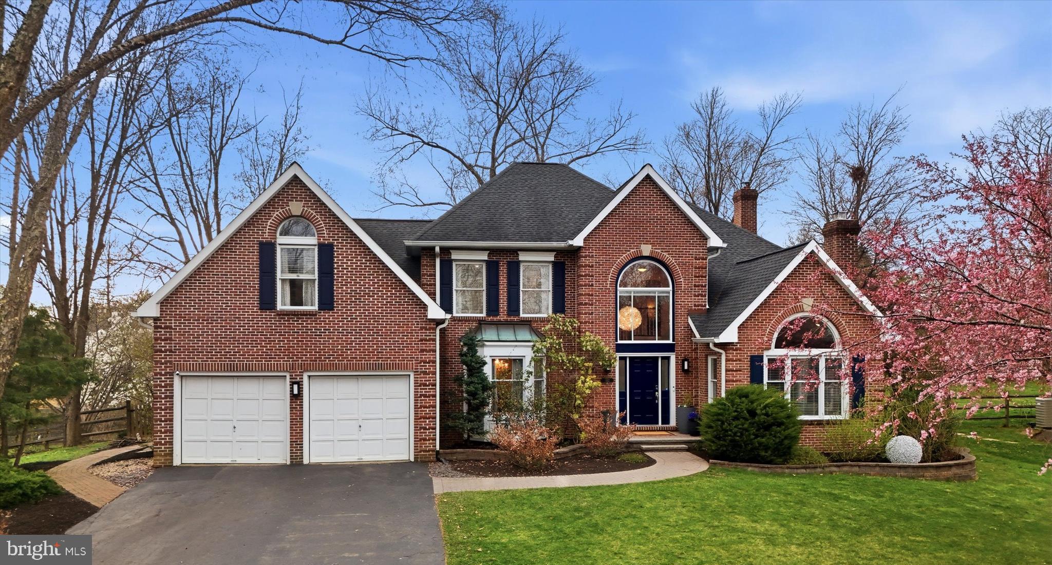 Welcome to 352 Sentry Lane—an elegant brick-front residence offering over 4,500 square feet of refined living on a beautifully landscaped, more than half-acre lot in the sought-after Valley Forge Estates community. Combining timeless curb appeal with thoughtfully designed interior and exterior spaces, this home delivers both sophistication and functionality at every turn.
A dramatic two-story entry foyer with soaring ceilings creates an impressive sense of arrival, setting the stage for the home’s expansive, light-filled interior. Designed for both everyday living and entertaining, the layout offers a seamless blend of formal and casual spaces with gracious proportions throughout.
The main level features expansive living and dining areas, ideal for both formal gatherings and relaxed daily living. The formal living room, with vaulted ceilings and a gas fireplace, enhances the sense of space while adding warmth and architectural character. At the heart of the home, the kitchen is both stylish and functional, featuring a large center island with seating, sleek quartz countertops, stainless steel appliances, rich cabinetry, and elegant pendant lighting. It offers abundant workspace and flows effortlessly into adjoining spaces.
The adjacent family room provides a welcoming setting for gathering, highlighted by a wood-burning fireplace that creates a cozy focal point and is surrounded by a wall of windows. A versatile first-floor flex space—ideal as a private office or playroom—adds flexibility to suit today’s lifestyle. A modern laundry room with cabinetry and additional storage enhances everyday convenience. Expansive windows, updated lighting, and a blend of hardwood flooring, high-end tile, and new carpeting create a bright yet comfortable atmosphere.

Upstairs, 4 generously sized bedrooms include a truly exceptional primary suite retreat. This private haven features a spacious bonus sitting room—perfect for a private lounge, office, or reading area. It also includes a fully outfitted walk-in closet with custom shelving and organization, a luxurious en-suite bath complete with a jetted soaking tub, an oversized walk-in shower, and a double vanity. The 3 additional bedrooms are well-proportioned, filled with natural sunlight, and offer flexibility for various needs while maintaining comfort and scale. They are accompanied by an updated hall bathroom featuring a double vanity, gorgeous cabinetry, and contemporary subway tile.
The fully finished lower level of the home offers a thoughtfully designed recreation and entertainment space. Complete with an updated full bathroom, a bar area, a media space, and flexible zones for games or fitness, this level provides an exceptional extension of the home’s living space, along with ample storage.
Step outside to a private backyard sanctuary where outdoor living truly shines. A beautifully designed paver patio anchors multiple seating and dining areas, complemented by a fire pit, a grilling area, and separate lounge spaces—perfect for enjoying stunning sunsets year-round. The expansive, level yard—framed by mature trees and fencing—offers both privacy and space for recreation and open green space. The deep front yard, which receives morning sun, combined with the quiet cul-de-sac setting in a residential neighborhood surrounded by mature landscaping, enhances the home’s sense of space and tranquility. The attached two-car garage, which includes interior access, provides both convenience and additional storage.
Additional highlights include a newer HVAC system, a whole-home humidifier, Ideally located in 19087 Wayne, within Upper Merion Township, this home offers convenient access to local shopping, dining, and nearby parks and trails.This exquisite home is served by a highly regarded school district and boasts a newly constructed high school equipped with modern amenities, making it a state-of-the-art learning facility for the community. A place to truly call home!