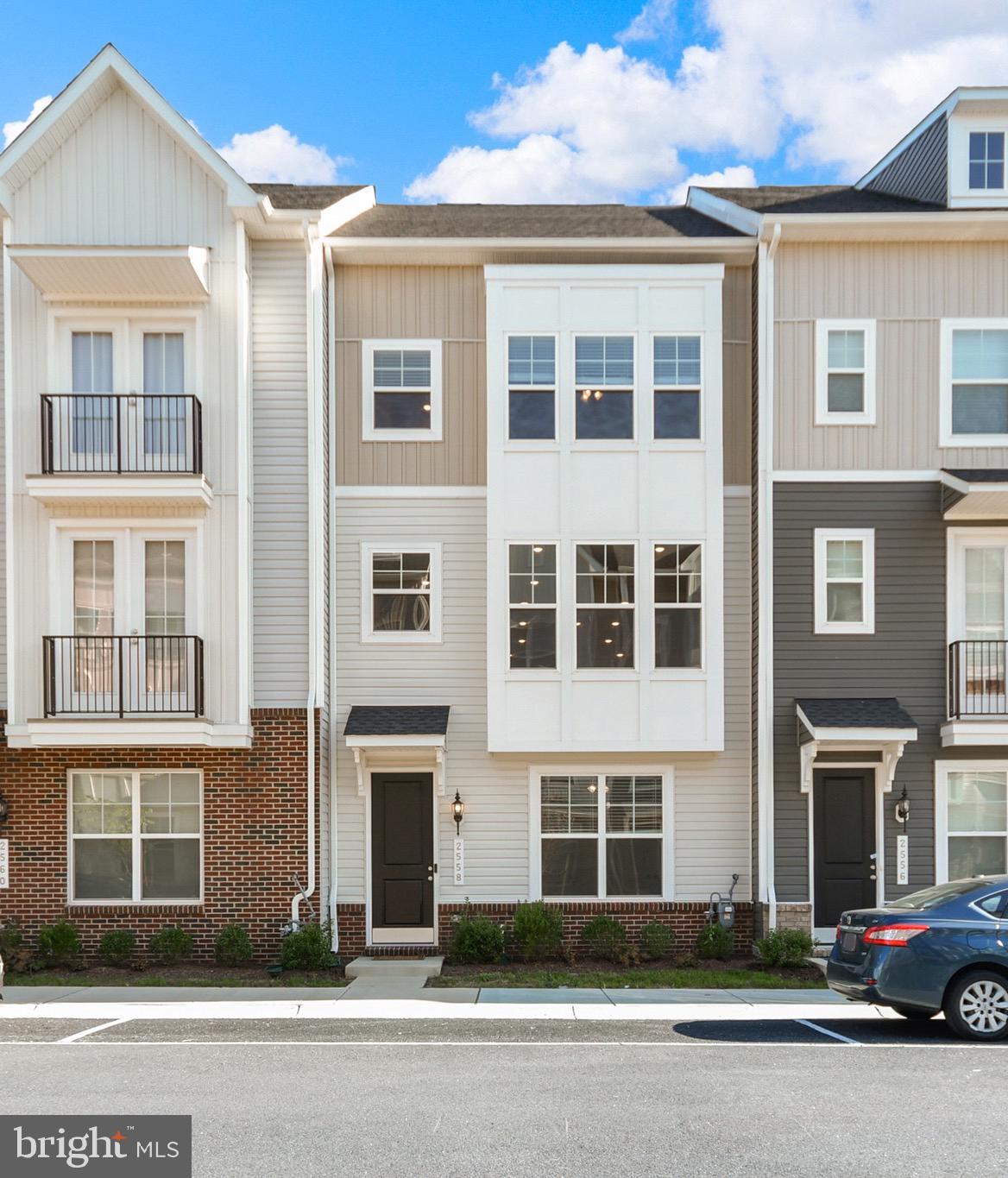 Exceptional value!    Must see this gorgeous Kempton I with Loft, Suite and rooftop deck, where clean lines, thoughtful design, and low-maintenance living come together in one of Frederick’s most desirable new communities.

This is not your average townhome. It’s full homeownership, set within a condo-style community, so you get the freedom of owning your home, with fewer headaches and many shared perks.

Built in 2024 and barely lived in, this four-level stunner checks every box. From the custom upgrades to the high-end finishes, it delivers the look, the function, and the feel today's buyers want, without the new construction wait or price tag.   The bonus lofts are rare, and were sold by the builder at a premium price, but seller is passing theirs through at an amazing value!

Upon entry, there's a private suite with full bath.  Perfect for guests, in laws, your work-from-home setup, or a quiet retreat. The rear-load two-car garage adds convenience and security and no detail is overlooked.

Upstairs, the main level is a showpiece. Soaring ceilings. sunlight everywhere. crown molding. Designer lighting. The kitchen is absolute perfection!   A gourmet setup with stainless steel appliances, quartz counters, crisp shaker cabinets, gas cooktop, double wall ovens, walk-in pantry, and an island that says, "Come in and stay a while." It flows right into a spacious dining area and open living space ideal for entertaining.

The third level features your primary suite retreat, fit for a king-sized bed and then some, with a large walk-in closet and spa-inspired bath with dual vanities and a glass walk-in shower. Two more bedrooms, another full bath, and laundry complete the level with both function and flair.

The top-level loft is the crown jewel,  complete with a wet bar, dedicated mini-split HVAC, and access to your own private rooftop terrace. Morning coffee, evening cocktails, weekend grilling, this is indoor-outdoor living at its best.

Located just minutes from shopping, dining, Wegmans, and the charm of Downtown Frederick, plus easy commuter access to I-70, I-270, and the MARC train. Trails, parks, and green spaces are right outside your door.

This is more than a home. It’s a lifestyle.  Turnkey, tasteful, and totally ready for you. Garage is even EV-ready!  

2558 Hopton Lane, come see what modern living was meant to be.