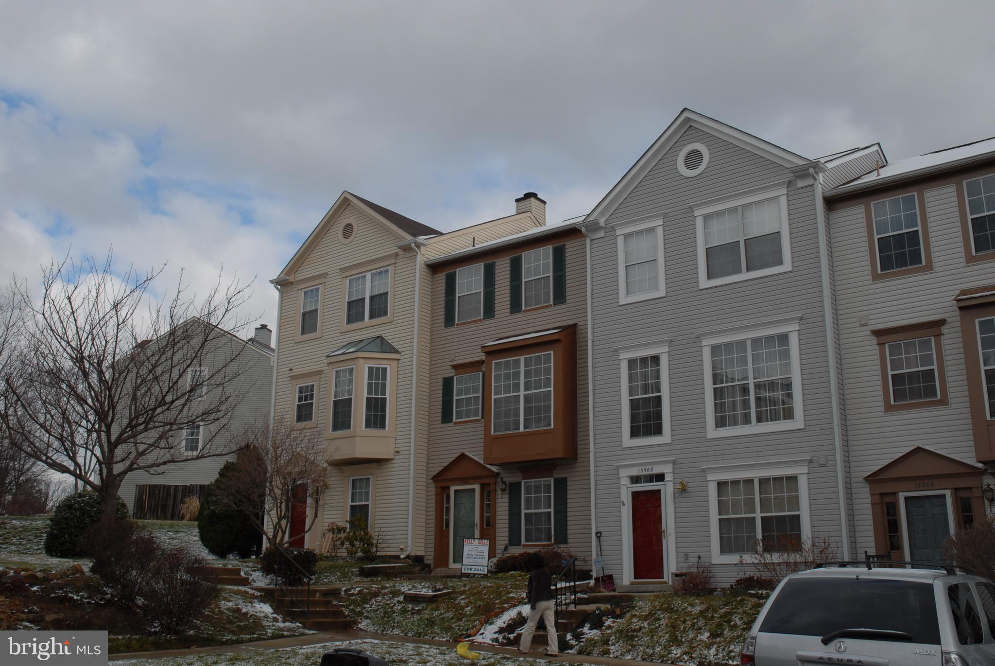 Bright and sunny Town house w/ 3 Beds & 2.5 Baths, Walkout basement w/ Den, Nice Hardwood Floors throughout all levels, Living Room door leads to entertainment deck overlooking fenced yard ,Don't miss it.