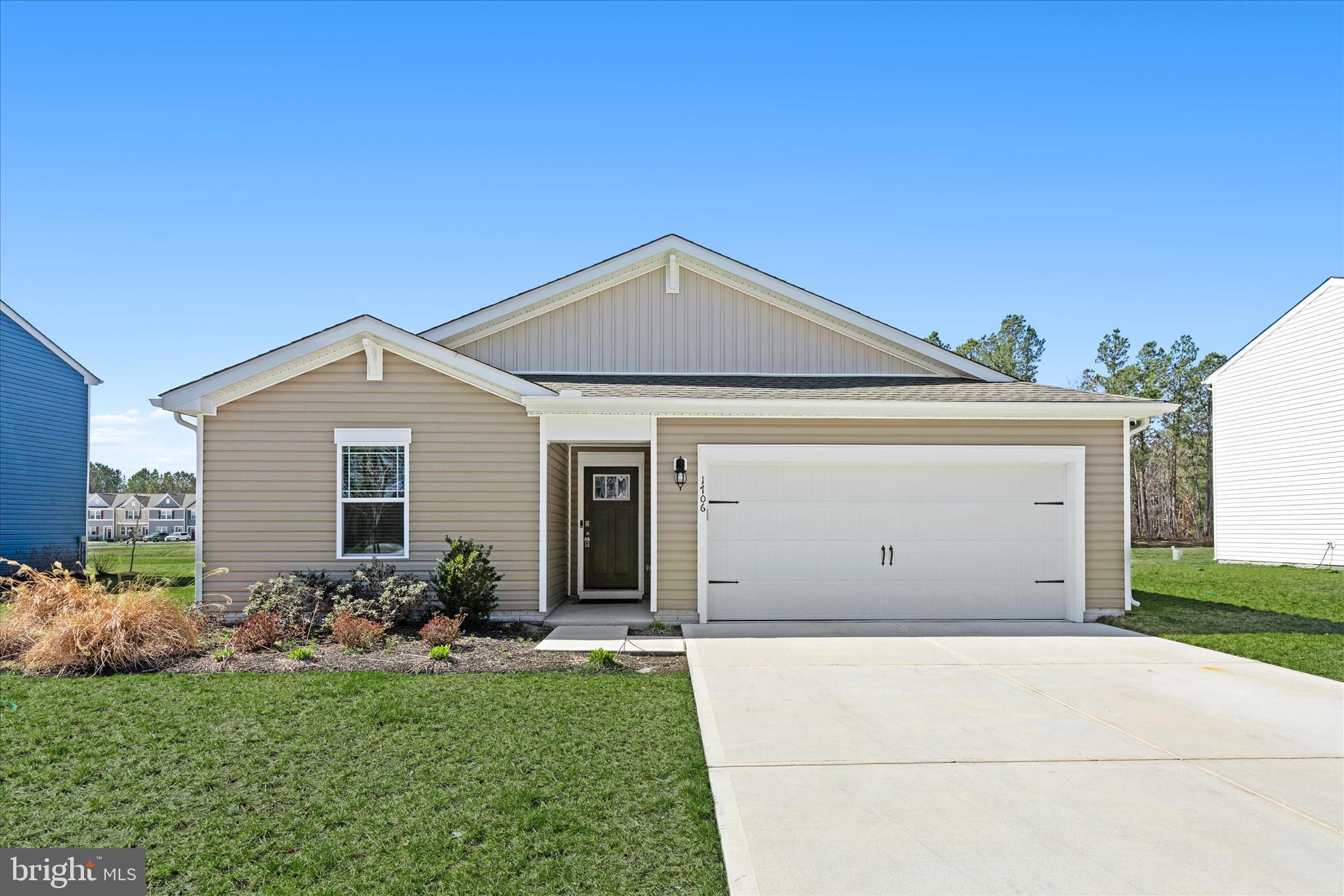 Discover the charm of this contemporary ranch-style home in the serene SASSAFRAS MEADOWS community. With 1,698 sq. ft. of thoughtfully designed space, this residence features four spacious bedrooms and two full bathrooms, perfect for comfortable living. The open floor plan seamlessly connects the inviting living and dining areas, ideal for gatherings and everyday moments. The heart of the home is the eat-in kitchen, complete with an island, pantry, and energy-efficient appliances, making meal prep a delight. Enjoy the convenience of a primary suite with a luxurious bath and walk-in closet. Recessed lighting throughout adds a warm ambiance, while plush carpeting and laminate plank flooring enhance the cozy feel. With a two-car garage and ample driveway space, parking is a breeze. This home is not just a place to live; it's a place to thrive.