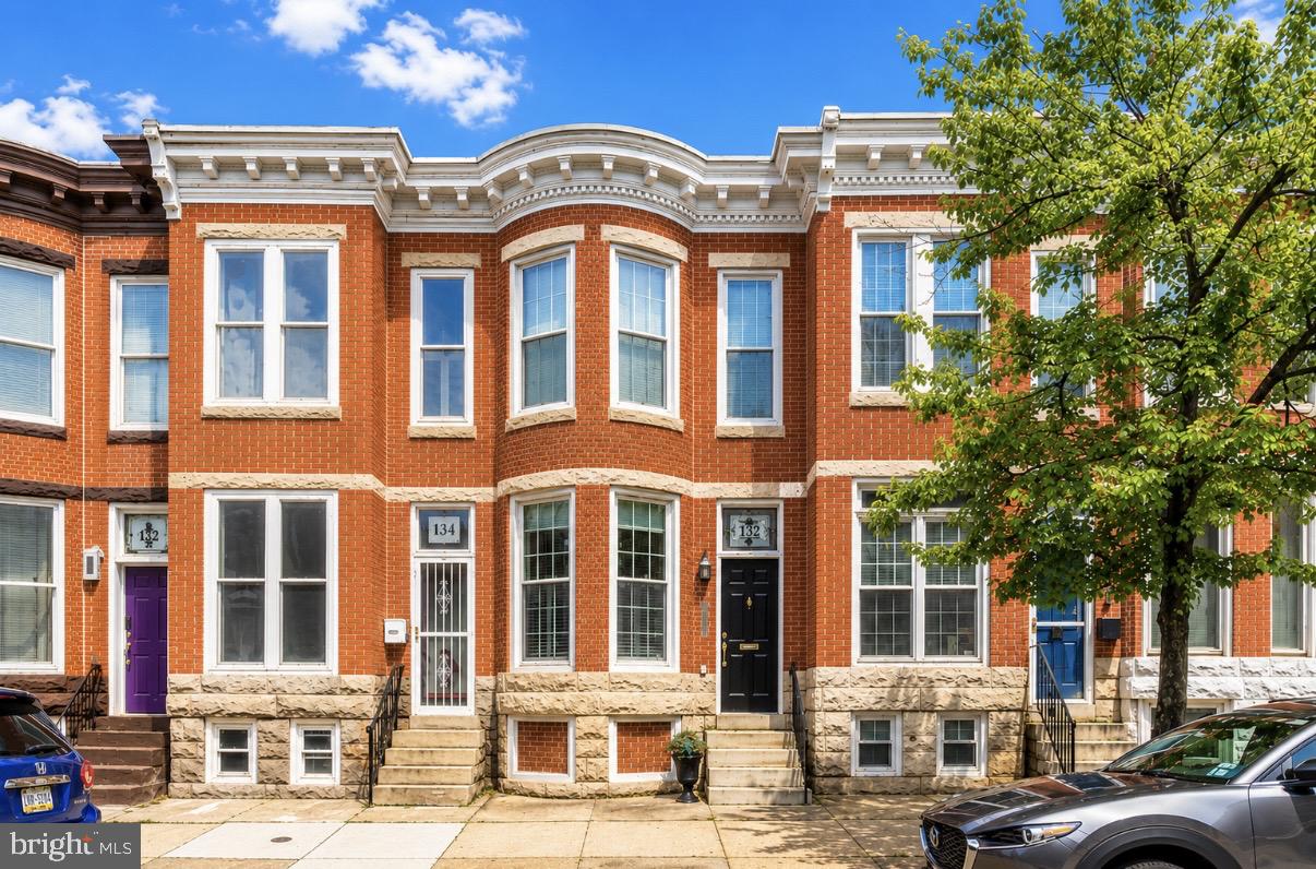 Exceptional Properties. Exceptional Clients. 132 West Ostend is a true Federal Hill unicorn, offering 2 bedrooms, 2 full baths, a private fenced yard, and rare two-car parking — all in pristine condition. Imagine enjoying everything Baltimore has to offer without ever stressing about parking or long commute times. From the moment you step inside the dramatic foyer, you’re welcomed by expansive windows, gleaming hardwood floors, and custom wrought-iron railings that add both warmth and character.

The main level features a comfortable sitting area, an updated kitchen, a dedicated dining space, and a full bath — perfect for both everyday living and entertaining. Upstairs, you’ll find two spacious bedrooms, another full bath, and a balcony with incredible views of M&T Bank Stadium. The bright and inviting lower-level family room offers plenty of space to host friends and family or simply relax at home.

Enjoy unforgettable sporting events at Camden Yards and M&T Bank Stadim, the best fireworks around, farmer's markets, museums, airshows, top-rated dining, vibrant nightlife, parks, shopping, historic parks and waterfront attractions. With easy access to I-95 and I-83, this home offers the perfect blend of lifestyle, convenience, and city living.