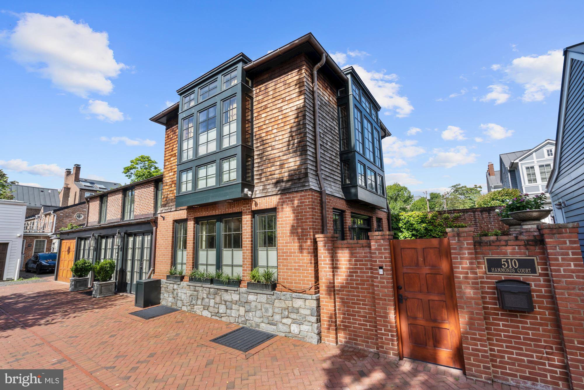 Welcome to 510 Hammonds Court, a beautifully transformed 1850s historic property, now a modern home filled with thoughtful custom designs at every turn.    Located in the heart of Old Town between two private alleys, this charming Carriage House is just steps away from the heart of King Street and its shops and restaurants.  3 bedrooms & 2 Full bathrooms on the upper level, plus a third full bathroom and built in Murphy bed/guest suite on the lower level.  Lower level rec room also boasted an extensive wine bottle wall system and built-in beer tap with perlick system.   Newly renovated gourmet kitchen includes a La Cornue stove, dining area with double sided fireplace and dual archways that lead into the light-filled living room.  Hardwood floors throughout, high ceilings, custom draperies, and special detail.  Numerous French doors create an indoor/outdoor living environment with the living room doors opening to a private bluestone patio featuring a tranquil water feature.   2,400 square feet in total, garage parking and surface parking.  A one of a kind home, a true treasure in Old Town with an unbeatable location.  Be sure to visit the 3D Tour!