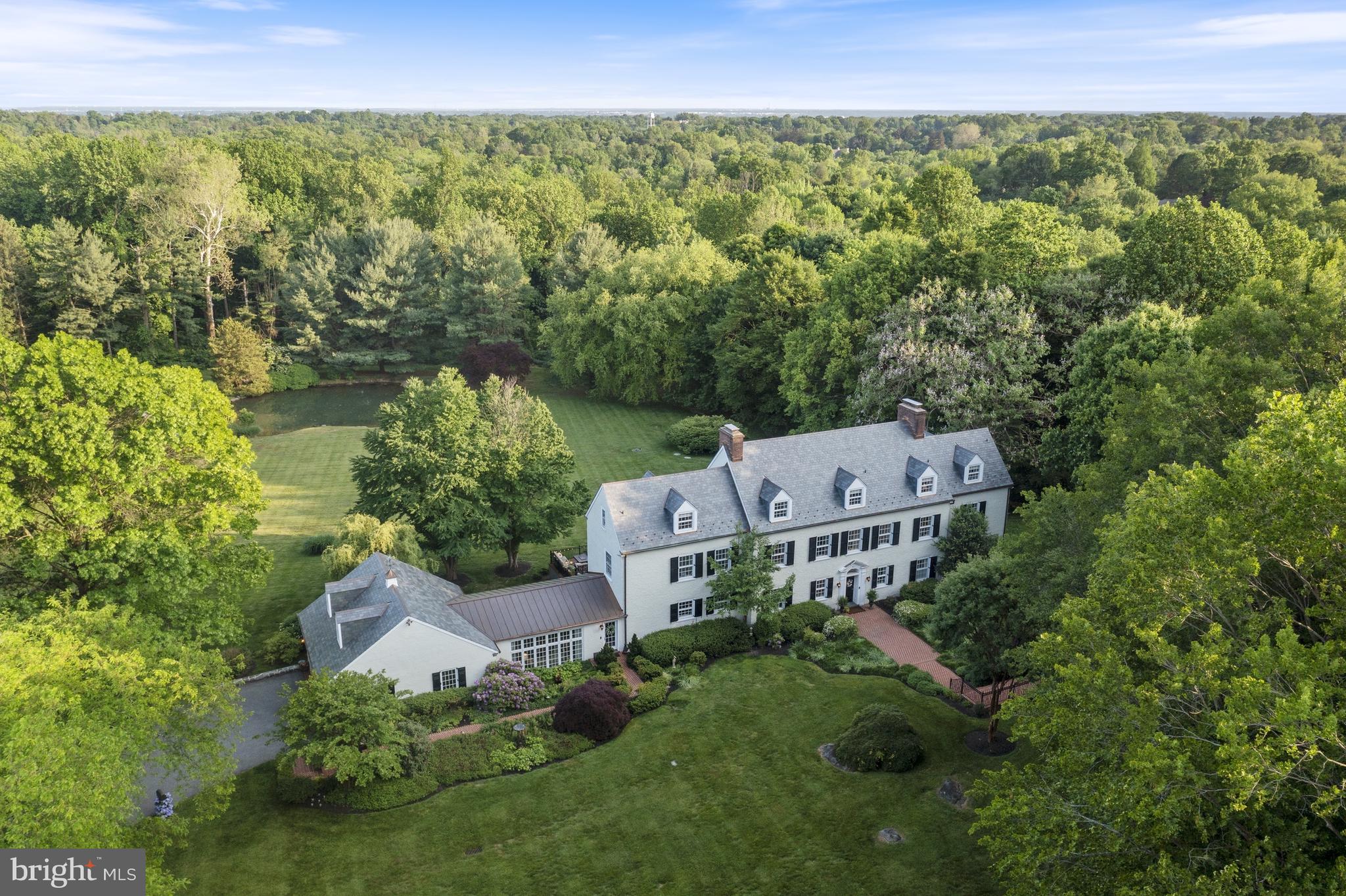 This listing has been updated to include the adjacent 2.48-acre parcel (known as 112 Kirk) with Carriage House and 2 BR Guest Cottage. The circa 1890 Delaware Blue Granite Carriage House features an open garage area for 7+ vehicles with 12' ceilings, antiques horse stalls, and a stunning 50' x 43' party-room loft with views over Wilmington Country Club's golf course. The 2-bedroom Caretaker's Cottage complements the exceptional architecture of the carriage house. The combined 8.48-acre Virieux estate was originally built by the du Pont family and sits in the heart of Greenville. This remarkable and truly one-of-a-kind property is steeped in Delaware history and has been lovingly updated to afford all the luxuries of modern living. The Manor House (known as 110 Kirk) sits on a 5.95-acre parcel with pond and noteworthy stone water tower. The stately 6BR, 6.1 bath manor house is set back off Kirk Road through a private gated entrance. The main floor retains its original elegance with arched doorways, pegged random width floors, original millwork, and three antique fireplaces. A newly updated gourmet kitchen sits at the heart of the home with tiger maple cabinetry, custom copper hood, top-of-the-line appliances, large island, and breakfast area that seats 6. Access the sprawling 24' x 95' terrace that spans the kitchen, formal living room, and family room, providing a perfect entertainment area that overlooks the expansive rear yard, pond, and gazebo. The second level houses the luxurious owner's suite including a large bedroom with fireplace, his and hers bathrooms, and individual dressing areas. Additional bedrooms and baths on the second and third floors provide plenty of room for family and guests. This unique property offers remarkable privacy in a park-like setting with close proximity to the shops and restaurants of Greenville and downtown Wilmington, as well as Amtrak and the I-95 corridor.
