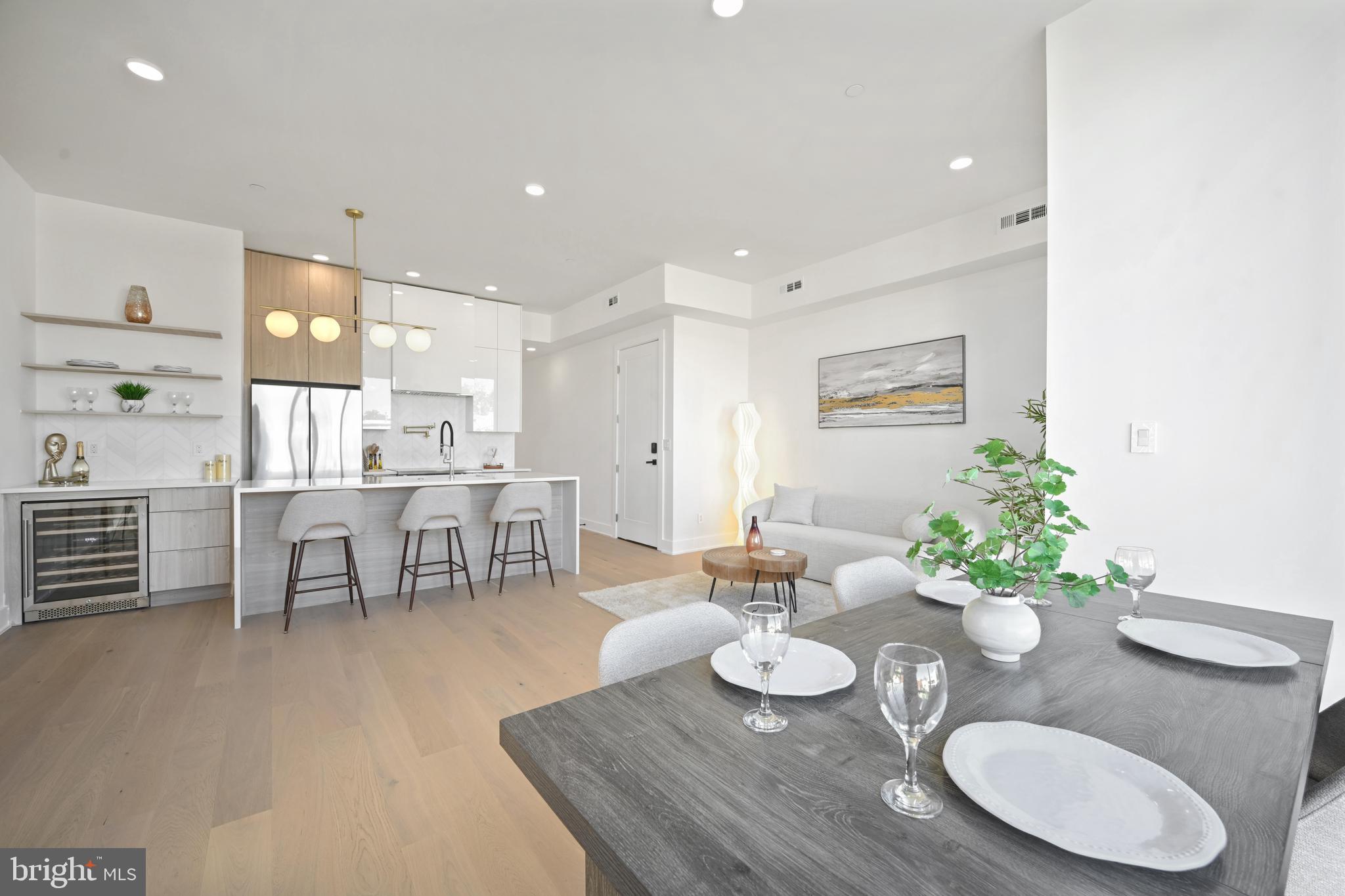 SELLER HELPS WITH 2% RATE BUYDOWN! Experience Luxury Living at The Lana Condominiums. The Lana Residences offer a timeless blend of modern design and thoughtful finishes, creating an unparalleled living experience. With elevated ceilings and expansive windows, these homes exude tranquility and a retreat-like atmosphere. The open-concept living spaces flow seamlessly, ideal for entertaining and gatherings. A powder room is conveniently located for guest use. The gourmet kitchen features European white oak and gloss white cabinetry, complemented by a spacious double-sided island with quartz countertops and waterfall edges. The custom bar, accented with open shelving, includes a wine fridge, while the kitchen's marble chevron backsplash pairs elegantly with a luxurious pot-filler, minimalist slide-in range, and refrigerator. Each residence is designed for both style and functionality, offering three bedrooms, two and a half baths, in-unit laundry, and access to an in-building storage unit. Enjoy breathtaking capital views right from your home. Lana Condominium is Located just minutes from the Red Line's Rhode Island Ave-Brentwood Metro station, The Lana is highly accessible and offers excellent transit options.  Immerse yourself in the neighborhood’s vibrant artistic scene, from colorful murals to local breweries. The Metropolitan Branch Trail offers bikers easy access to community spots like the Dew Drop Inn, a beloved local hangout. Nearby cultural hubs like the American Poetry Museum and Busboys and Poets host open mics and writing events, while the new Edgewood Recreation Center provides outdoor fun with a playground, sports field, and rooftop community garden. Gated parking spots are available for purchase.
