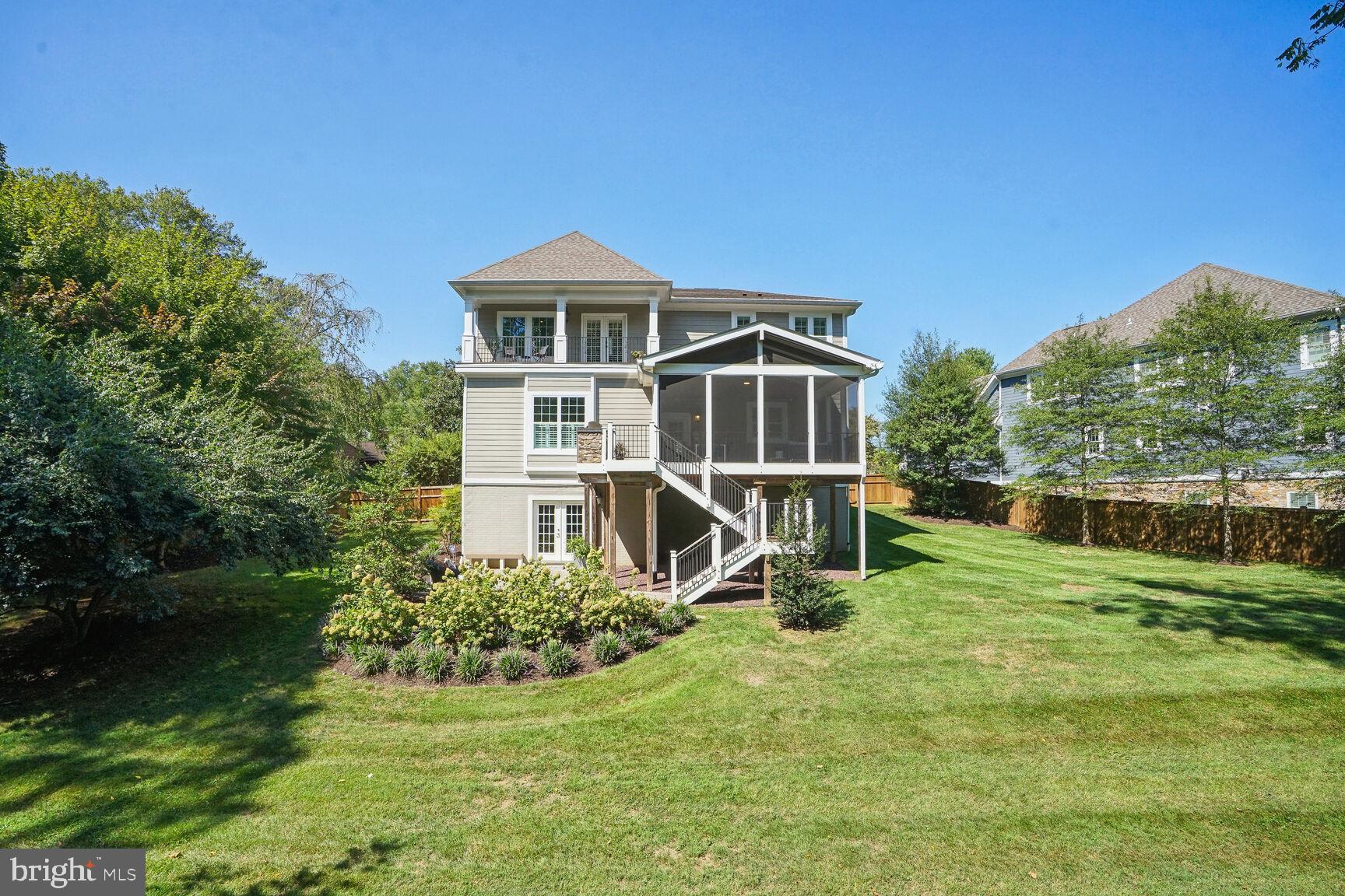***OFFER DEADLINE TUESDAY 9/10 AT NOON***You will fall in love with this home, but your jaw will drop when you see what awaits you out back. This impressive home offers details expected by buyers seeking “new builds,” while also providing a generous WIDE HALF ACRE LOT on a cul-de-sac that BACKS TO PARKLAND.  A winning combination rarely available.  The charming facade with inviting covered front porch belies the grandeur of this 5500+SF home boasting 5 bedrooms/5 full and 2 half baths with an impressive in-law/aupair suite option *** Step inside to enjoy the gorgeous walnut wood floors, 10' ceilings, beautiful wood detail and generous open floor plan. Impressive craftsmanship throughout the house begins in the formal living and dining rooms off the entrance foyer. Near the front of the house is a convenient mudroom with ample storage. A main level office with built-in bookshelves and desks provides superb at-home workspace. ***  Stroll through to the great room with coffered ceilings, a gas fireplace and stunning view of the property. The gourmet kitchen features THERMADOR PROFESSIONAL APPLIANCES, a large cooking island with 6-burner cooktop and large ceiling mount chef’s hood. Enjoy outdoor dining year-round in the  21’ X 17’  HEATED SCREEN PORCH, with views of the amazing wooded parkland at the rear of the property. An outdoor kitchen with gas grill and 2-burner cooktop is just outside the screen porch; you can grill while enjoying the views! The tree-lined privacy is wonderful, but the width of the property is an unexpected delight  *** Enjoy your morning coffee on the 20’+ balcony, off the spacious primary suite on the upper level, overlooking the tree-lined vista. The primary suite includes a tray ceiling and separate walk-in closets. The luxury primary bath has an ARCHITECTURAL STAND ALONE SOAKING TUB and large walk-in shower. The upper level has three other generous bedrooms, each with an ensuite bath and walk-in closets ***  The incredible lower level is ideally designed for entertaining. The pool table has hidden storage with large copper pendants, shiplap woodwork and a CEILING CLOUD defining the space. The bar area has a copper sink, wine and beverage fridges and drawer-style dishwasher.  The 85” built-in TV is equipped with wiring and mount for a Sonos Arc sound bar plus wiring in the ceiling for Sonos One speakers. The floor-to-ceiling brick tile TV area includes a heat and color controlled 72” linear electric fireplace.  Also on this daylight lower level, is a bright guest suite with large windows and ensuite bath. There is a top quality mirrored workout room and powder room to complete this remarkable garden level. Walk out to the hydrangea-lined patio and landscaped, fully fenced backyard. A gate leads to Pimmit Run at Kent Gardens park which is a perfect place for a stroll. The backyard could easily accommodate a pool with still plenty of green space. ***  The garage offers tons of custom storage including motorized bike and shelving storage from ONRAX *** Kent Gardens, Longfellow, McLean school pyramid.  Easy access to West Falls Church and McLean Metrorail stations, Tysons, Capitol Beltway and DC.