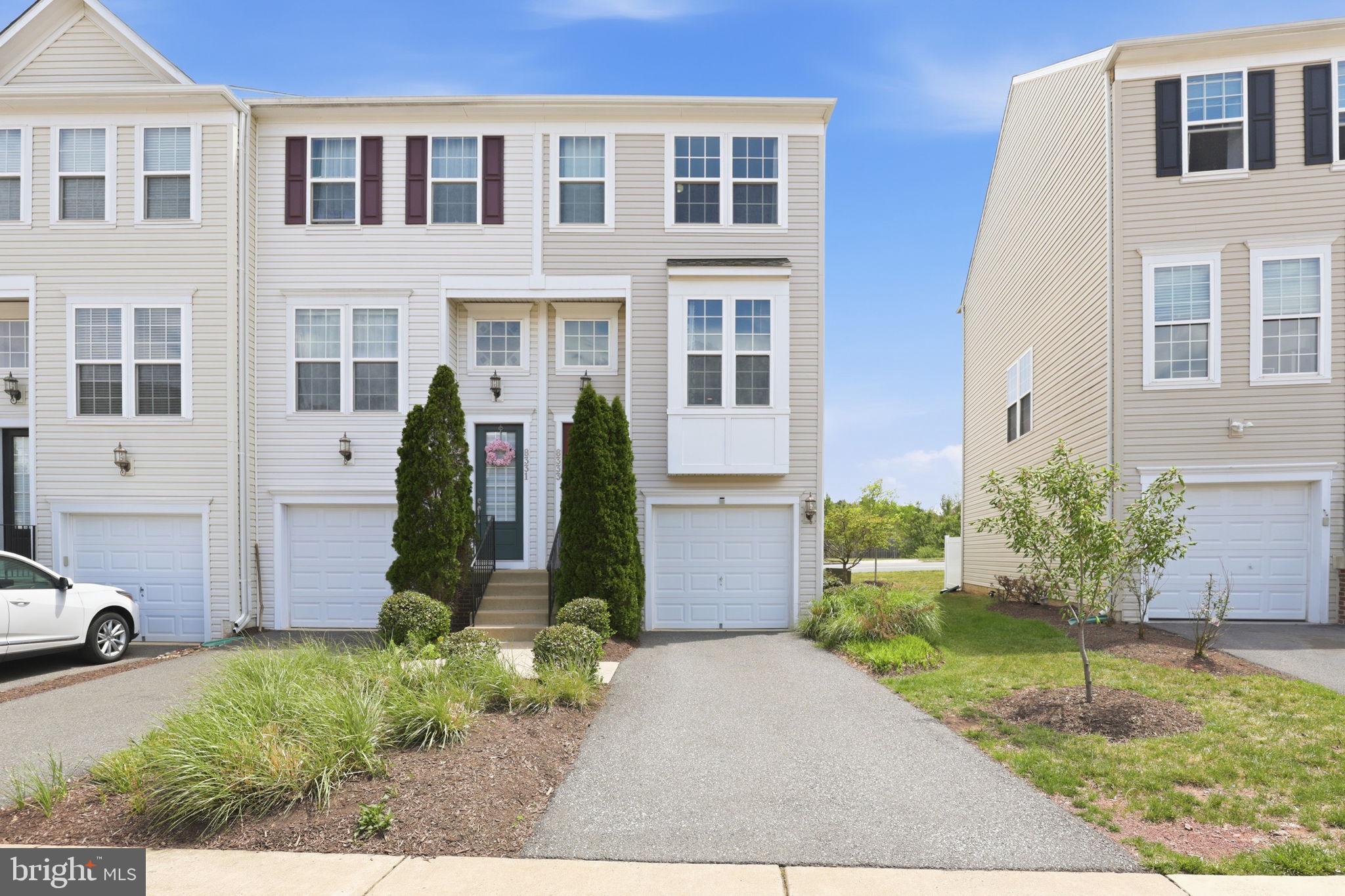 Beautifully upgraded end-unit townhouse-style condo located in the sought-after Heritage Crossing community of Manassas. Built in 2013 with the builder’s full upgrade package, this spacious three-level home offers stylish finishes, a one-car garage, private driveway parking, and a large rear deck perfect for relaxing or entertaining.

The main living level showcases an open-concept design with rich dark hardwood flooring, soaring 9+ foot ceilings, and abundant natural light throughout. The gourmet kitchen is the centerpiece of the home, featuring granite countertops, stainless steel appliances, ample cabinetry, and seamless flow into the dining and living areas.

Upstairs, the primary suite offers a walk-in closet and private en-suite bath, while an additional bedroom and full bath provide comfortable accommodations for family or guests. The lower level includes a versatile bonus room or potential third bedroom complete with an adjoining full bath—ideal for a guest suite, home office, or recreation space.

Conveniently located just off Sudley Road near major commuter routes, shopping, dining, Prince William Medical Center, Old Town Manassas, and the VRE. Residents of Heritage Crossing enjoy exceptional community amenities including an outdoor pool, clubhouse, tennis courts, and playgrounds. This move-in-ready home combines comfort, convenience, and location all in one.