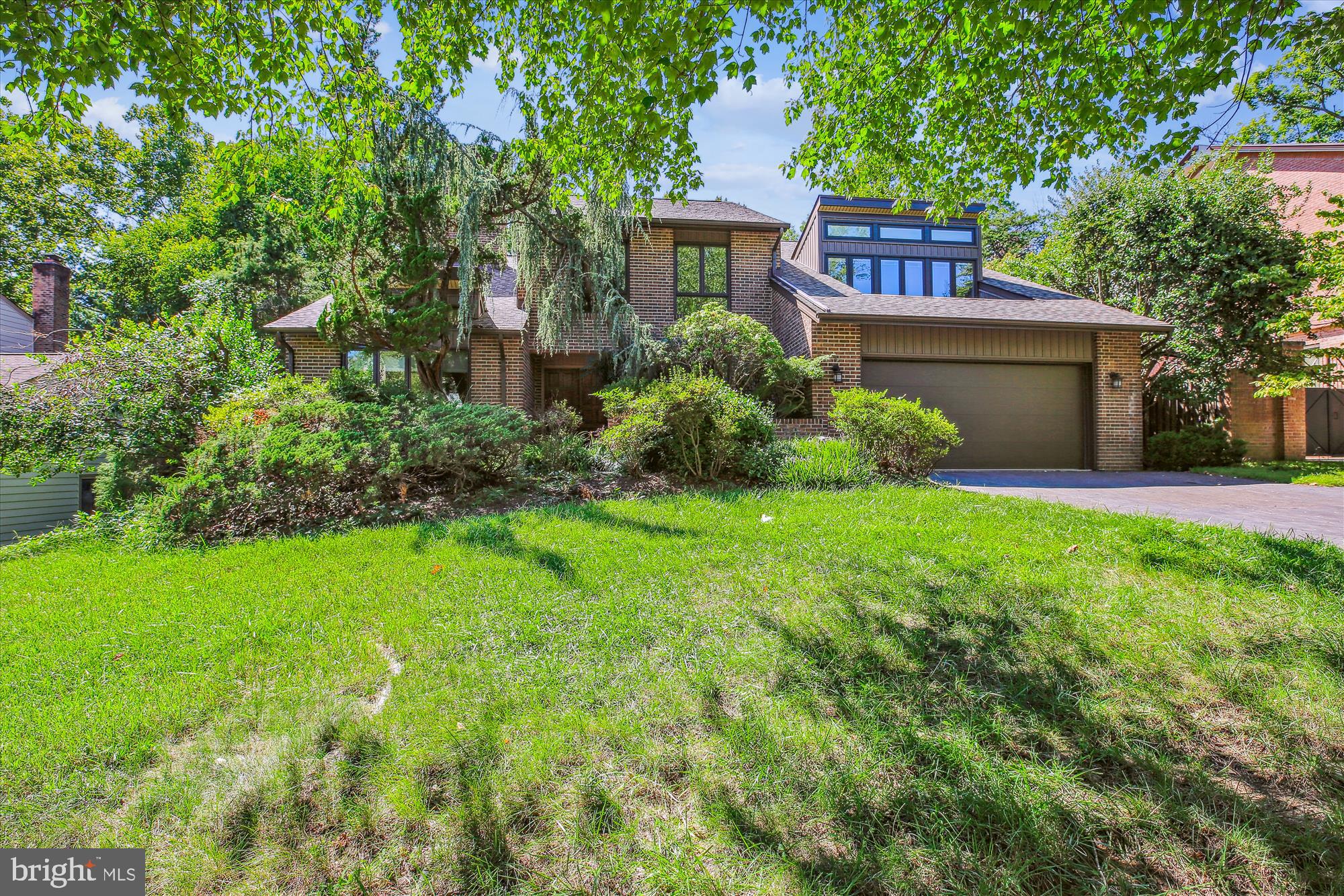Welcome to this sprawling brick home in the highly sought-after West Bethesda Park, located in the coveted Whitman, Pyle, and Burning Tree school district. This spacious four-bedroom, five-and-a-half-bath home, with two additional office/guest rooms, is thoughtfully designed for large-scale entertaining and comfortable family living. Blending contemporary design with superb architectural details, the residence features wood flooring, recessed lighting, updated casement windows, and a striking dual-sided brick fireplace. This home offers an abundance of space and style, perfect for both everyday living and special gatherings!

The inviting foyer opens to a formal living room with elongated clerestory windows and soaring ceilings. Between the living and dining rooms is an architectural focal point: a magnificent dual-sided brick fireplace. The gracious dining room is adorned with grass cloth wallpaper and large windows, creating a sophisticated space. The spacious family room, complete with its own brick fireplace, built-ins and access to the patio, seamlessly flows into the chef’s kitchen. This expansive granite kitchen is outfitted with high-end appliances, including a Thermador range and a Sub-Zero side-by-side refrigerator. It also features a center island, wood cabinetry with soft-closed drawers, a wet bar, a pantry, and a sun-filled breakfast room with a built-in desk area. The main level is completed by a versatile bedroom/office, a powder room, a mudroom/laundry room, a spacious walk-in closet, and access to the two-car garage. 

Upstairs, you will find four generously sized bedrooms and four full bathrooms. The spacious primary suite offers a sun-lit sitting area, a walk-in closet, two additional large closets and more storage space, and two separate bathrooms. Additionally, another bedroom upstairs is a convenient en-suite with its own attached bathroom.

The lower level offers a massive recreation room with sliding doors leading to the backyard, a convenient guest room/office, a gym/playroom, a dual-entry bathroom, and a second refrigerator and ample storage space. 

Outside, the picturesque backyard includes a large deck with a gas line for grilling, and a two-car garage. The roof was replaced in 2019 and comes with a warranty, ensuring peace of mind for years to come.

With spacious rooms, a versatile floor plan, and incredible location, this home provides unparalleled livability and comfort. While it could benefit from some cosmetic updating, it presents the perfect opportunity to customize and transform this home into your own oasis.  Good after renovation comps are 7 Springer Ct sold for $2,380,000 in June 2023 and 7403 Spring Road sold for $2,000,000 in May 2022.  

 Ideally located in the Whitman community, this home is conveniently close to Pyle Middle School, Whitman High School, Downtown Bethesda, shopping, and the Capital Beltway. Don't miss this fantastic opportunity!