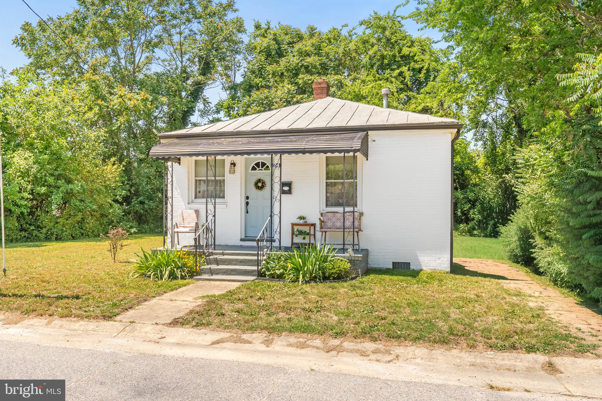 Welcome to this beautifully updated 2-bedroom, 1-bath brick home in Petersburg. Built in 1951, this charming residence features a covered front porch perfect for relaxing or entertaining. Inside, you’ll find freshly refinished hardwood floors, fresh neutral paint, and abundant natural light throughout the main living areas.

The remodeled bathroom offers, updated fixtures and lighting, tub-to-ceiling tile surround, luxury vinyl flooring, and farmhouse-style cabinetry. The spacious eat-in kitchen has been fully updated with granite countertops, white cabinetry, tile backsplash, and stainless steel appliances. A mudroom with washer and dryer hookups provides added convenience and direct access to the exterior. The crawl space has also been updated with a vapor barrier and insulation for improved efficiency.

Situated on a flat, grassy lot with room for future outdoor living space, this move-in ready home offers both character and modern updates.