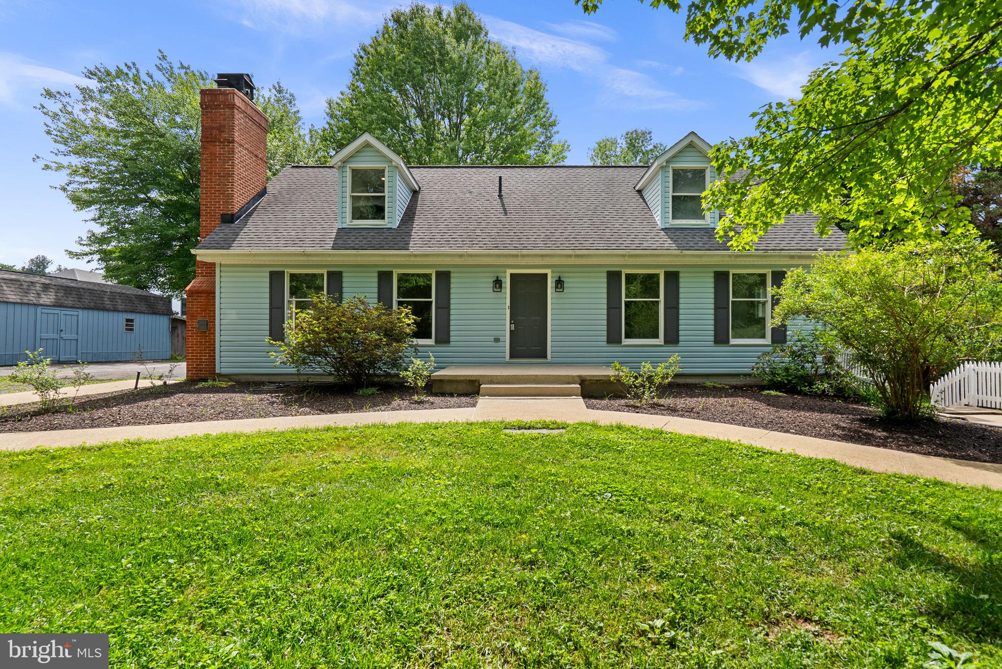 Fully remodeled Cape Cod-style residence offering 3 bedrooms, 3.5 bathrooms, and 1,872 finished square feet on over an acre in sought-after Clarksville. Thoughtfully and extensively updated in 2026, this exceptional home showcases refreshed interiors with comprehensive painting, updated lighting and electrical fixtures, beautifully renovated bathrooms, a refreshed kitchen with refinished cabinetry and updated hardware, new upper-level carpeting, and numerous exterior improvements, including a full exterior wash. Additional enhancements include updated switches and outlets, LVP flooring, upgraded fixtures throughout, basement utility space improvements, and much more. // A long private driveway leads to this charming residence, where hardwood floors flow throughout much of the main level. The welcoming foyer opens to a sunlit living room filled with natural light from oversized windows and anchored by a floor-to-ceiling brick-accented wood stove, creating a warm and inviting atmosphere. A formal dining room with patio access provides an ideal setting for gatherings, while a convenient powder room serves the main level. // The beautifully updated eat-in kitchen (2026) features stainless steel appliances, including double ovens, white cabinetry, a subway tile backsplash with decorative accent strip, exterior access, and an adjacent breakfast room with sliding doors to the patio for seamless indoor-outdoor living.  // Conveniently located on the main level, the primary suite offers laminate flooring, chair rail detailing, a walk-in closet, and a private ensuite bath with dual vanities and a soaking tub. Upstairs, two additional bedrooms with vaulted ceilings provide comfortable accommodations, complemented by a full bathroom and charming hallway built-ins. // The lower level expands the home's versatility with a recreation room featuring a rustic lodge-inspired aesthetic and stone-accented fireplace, a kitchenette, a full bathroom, a laundry area with washer and dryer updated in 2018, and a flexible bonus room ideal for a home office, hobby space, or potential guest accommodations, conveniently located near the exterior walk-up access. // Outdoor living is equally inviting with a patio surrounded by lush landscaping, multiple storage sheds, and expansive open green space, creating a peaceful, private setting. Additional major updates include the roof (2015) and HVAC system (2026) with a transferable warranty, offering added value and peace of mind.