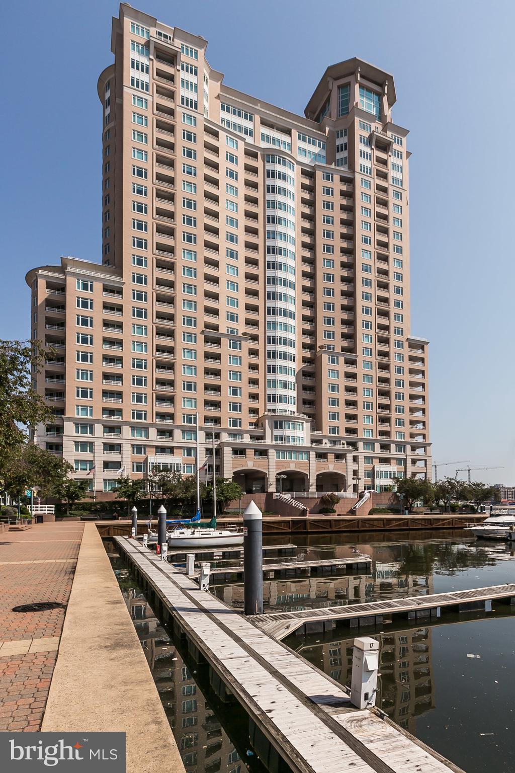 SUNLIT LUXURY APARTMENT with GREAT VIEWS ready for immediate occupancy! Highlights include spacious LR/DR area walks out to large covered balcony for year-round dining, eat-in kitchen offers new quartz countertop, 2nd balcony, lots of pantry/cupboard space. MBR bay window opens to Domino sign and Fort McHenry views and offers beautiful sunrise. MBR walk-in closet, large bath with oversized whirlpool tub, stall shower, marble accents. Full size W/D, and secured garage parking with assigned space included. Plenty of guest parking and additional spaces available to rent. Full service luxury building with array of building amenities! 24/7 concierge with valet parking, extensive fitness center, steam/sauna, pools, business ctr, billiards, guest suites, lounge, grill and picnic area! Beautifully landscaped grounds with onsite restaurants, gourmet deli, walking/jogging paths, and 24/7 security staff! Excellent location close to shopping, nightlife, restaurants, stadiums, MARC train, and only 9 miles to BWI Airport! Available NOW!