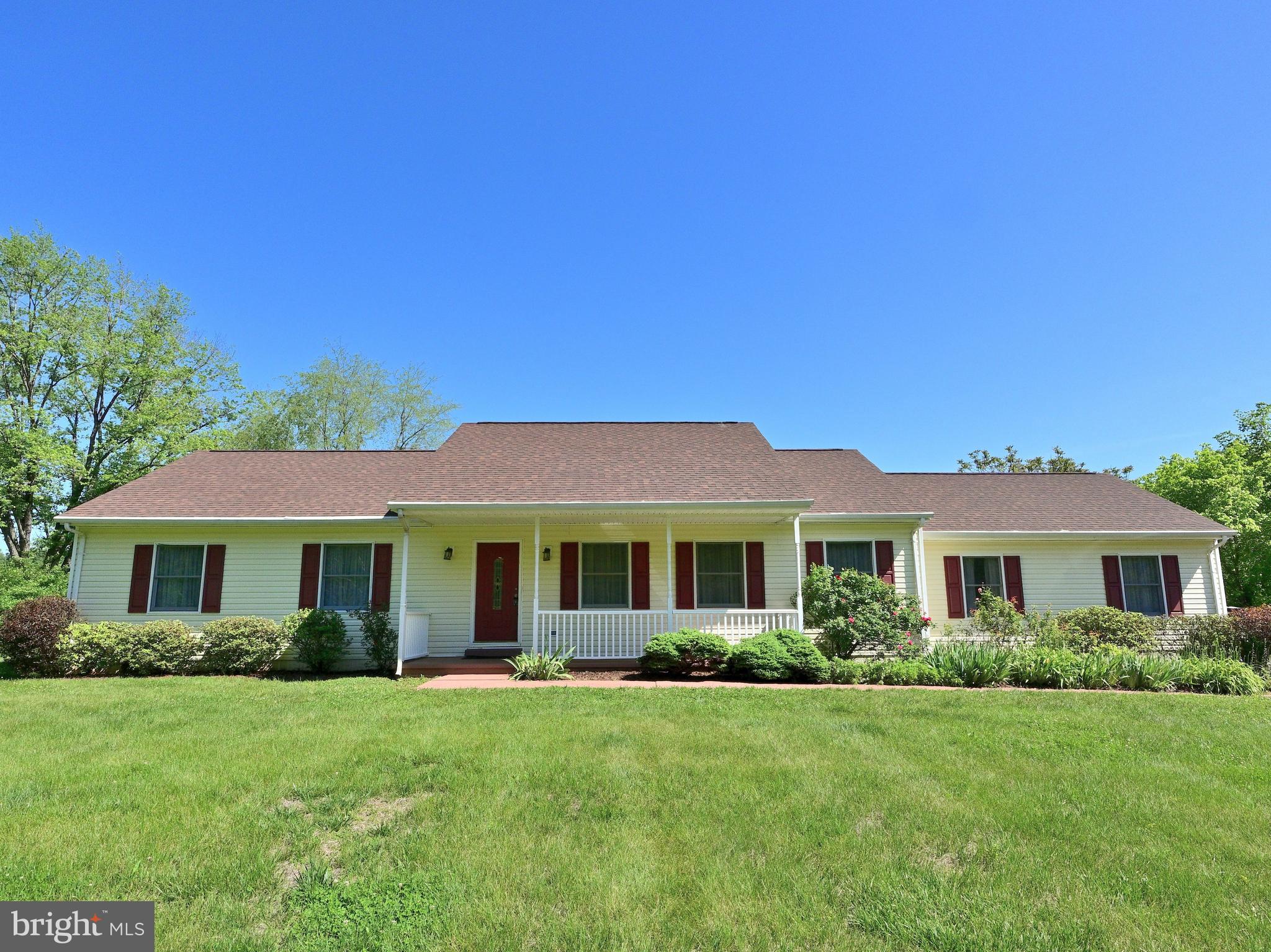 Surround yourself in this peaceful setting and still enjoy easy access to all major roads.  Expansive rambler offers ample room sizes throughout.  Major renovations to home include:  2016 new  siding. 2022 new roof. 2017 new appliances and flooring.  2021 HVAC.  Distribution box replaced in 2017.  Huge rear deck with retractable awning overlooks great back yard area.  Wide and welcoming front porch overlooks big front lawn.  Lovely landscaping and even a shed for all your projects.  Wonderful kitchen offers stainless steel appliances with granite counter tops, impressive storage and work space.  Family room off the kitchen is enhanced with an electric fireplace.  Huge laundry room offers nice space for your additional shelving or storage and pull down stairs to attic.  Extra Bonus Room offers more storage or additional living space; Initially this was a two car garage.  The living room, dining room, family room and kitchen flow seamlessly together, making the layout feel bright, airy, and spacious.  Wonderful condition, fantastic location await you in this one level living impressive rambler.