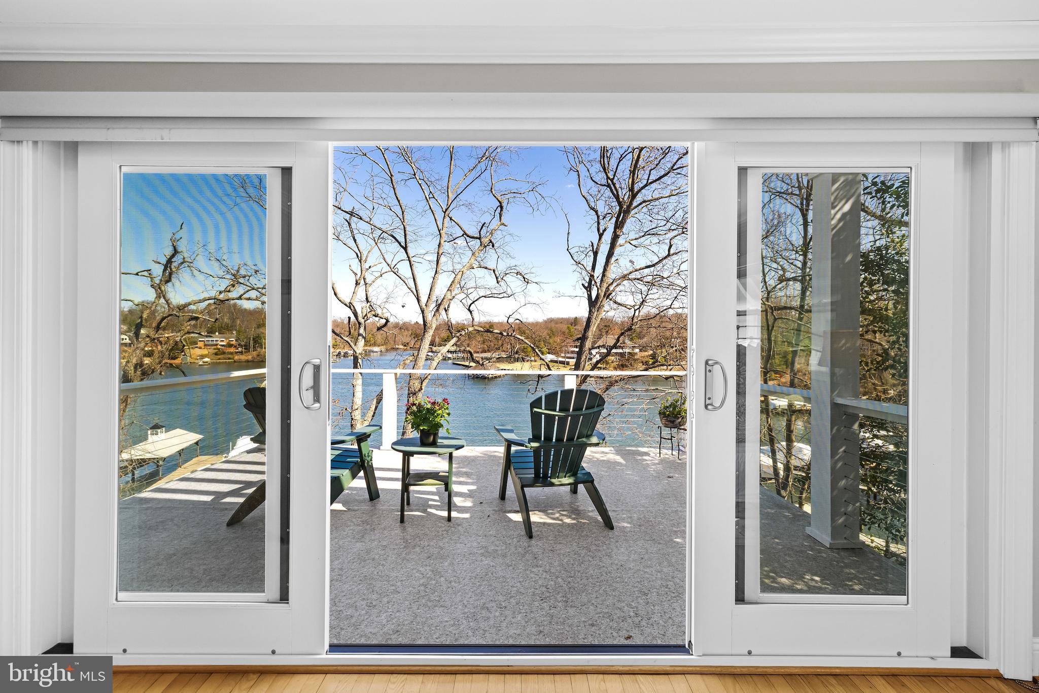 Welcome to a rare waterfront retreat tucked away in a secluded, wooded cove in the highly sought-after Linstead community, in the heart of Severna Park. Perfectly blending timeless coastal elegance with modern luxury, this exceptional residence offers breathtaking water views from nearly every room and an unparalleled lifestyle on the Severn River.
Originally renovated in 2014 and thoughtfully expanded and enhanced in 2017, the home was designed to maximize comfort and connection to the surrounding waterfront. From the moment you step through the front door, you are greeted by sweeping panoramic views of the water, creating an immediate sense of tranquility and escape.
The entry landing opens to an expansive, light-filled living room with walls of windows and access to a private waterfront deck—an ideal setting for morning coffee or evening sunsets. Adjacent to the living area, the gourmet white kitchen seamlessly flows into the sun-drenched dining room, a stunning owner-designed addition that beautifully combines style, functionality, and captivating views.
Also on this level is one of the home’s three bedrooms, complete with an en-suite bath, generous closet space, and convenient access to the laundry area.
Just a few steps above, the second level features an inviting waterfront sitting area with a balcony overlooking the cove, echoing the dramatic scale and openness of the living room below. The luxurious primary suite serves as a private sanctuary, offering its own waterfront deck, walk-in closet, and spa-inspired en-suite bath. An additional spacious bedroom and beautifully appointed full bath complete this level.
The top-floor expansion introduces two versatile bonus rooms—one showcasing stunning water views and the other featuring a private balcony retreat. A stylish half bath completes the space, making it ideal for a home office, artist’s studio, fitness area, or guest accommodations.
Outdoor living is equally impressive. Beneath the main level, a covered waterfront patio creates the perfect backdrop for al fresco dining and entertaining, with ample overflow space for larger gatherings. A reimagined storage area offers endless possibilities for a home gym, recreation room, or custom entertainment space.
From every level of the home and patio, the landscape gently cascades toward the shoreline, framing serene water views at every turn. In 2024, the owners completed extensive shoreline and structural improvements, including the installation of state-of-the-art sediment control fabric, new seeding for erosion management, and a foundation anchoring system designed to preserve the integrity and beauty of this remarkable waterfront setting for years to come.
Completing the property’s exceptional amenities are direct water access for swimming and kayaking, an outdoor shower, a 100-foot pier, and a powered vertical boat lift—offering effortless enjoyment of the Chesapeake lifestyle.
Located in the prestigious Linstead neighborhood, this extraordinary home provides convenient access to the Severn River, top-rated Severna Park schools, and the very best of waterfront living. Whether enjoying sunrise coffee from your private balcony or unwinding with sunset views across the cove, this residence offers a rare opportunity to experience luxury waterfront living at its finest.
A truly exceptional offering—schedule your private tour today.