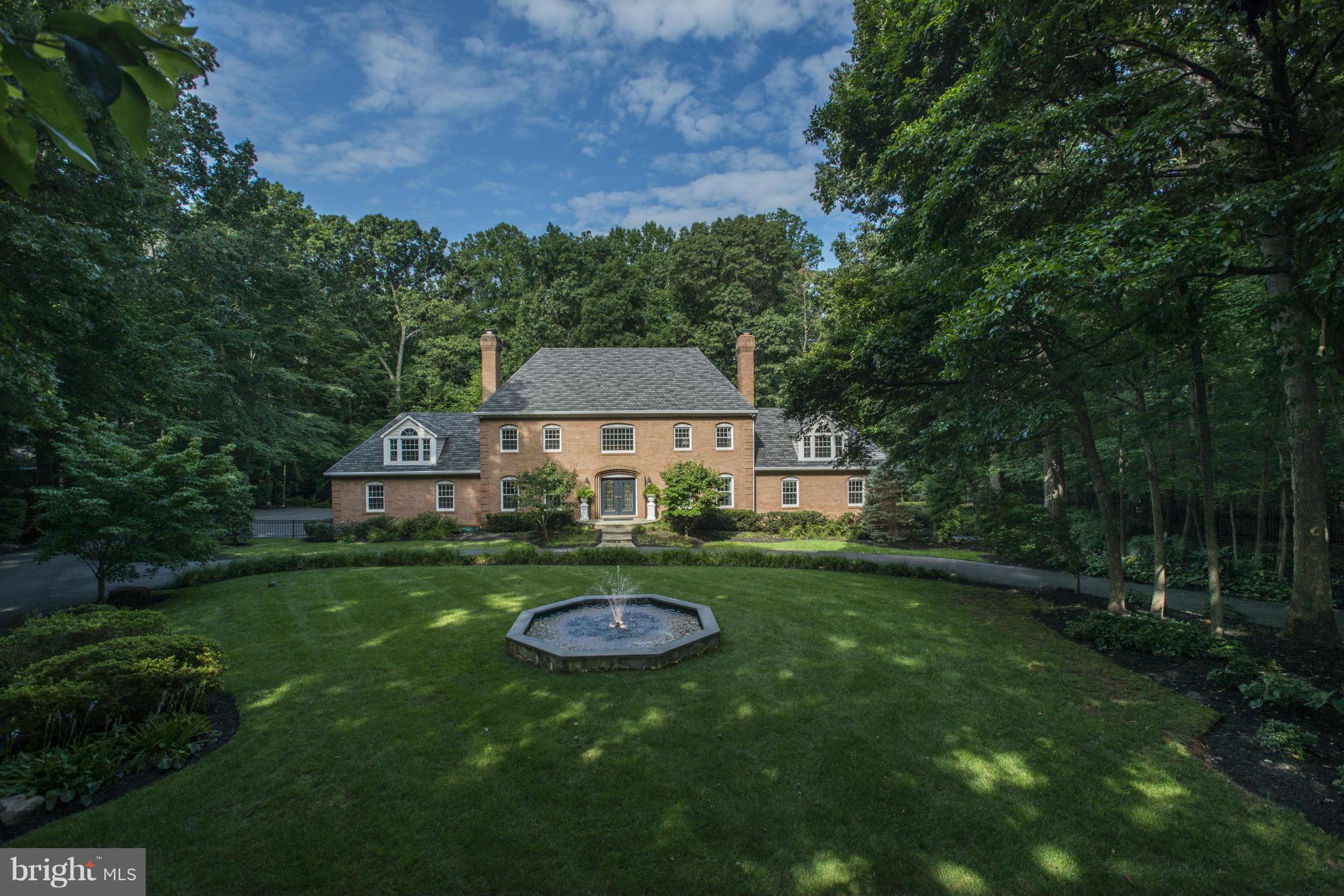 Exquisite 4 level Colonial on nearly 3 fenced acres, GATED, circular driveway on private rd. Brand new gourmet kitchen, mudroom, luxurious master suite w/ fp, balcony, newly renovated master bath & walk-in closet/dressing room w/ W/D, fully finished walkout lower level. Backyard offers a pool, two spas, large deck & over $300k in improvements. 4-car garage. Seller Financing/Owner Licensed Realtor