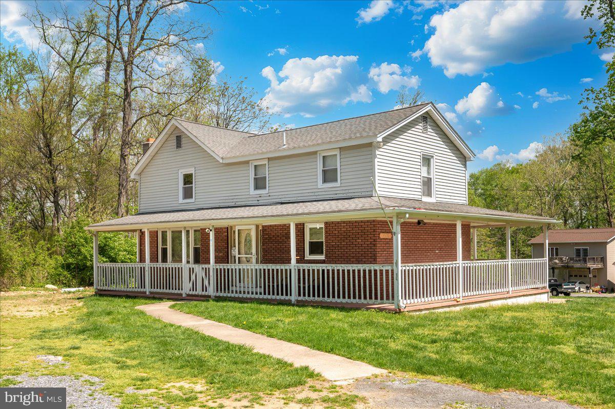 Welcome to this charming colonial home set on nearly an acre. Featuring 3 bedrooms and 1 full bath, a spacious kitchen, complete with an oversized island, granite countertops, and stainless steel appliances. It flows seamlessly into the living room, creating an ideal space for everyday living and entertaining. A convenient main-level laundry and mudroom. . Step outside to enjoy the inviting wraparound porch, perfect for relaxing and taking in the peaceful surroundings. Large yard iwith al stream running through the property and a storage shed for added utility. Many updates were completed in 2017, and the garage has already been started—ready for your finishing touches to make it your own.