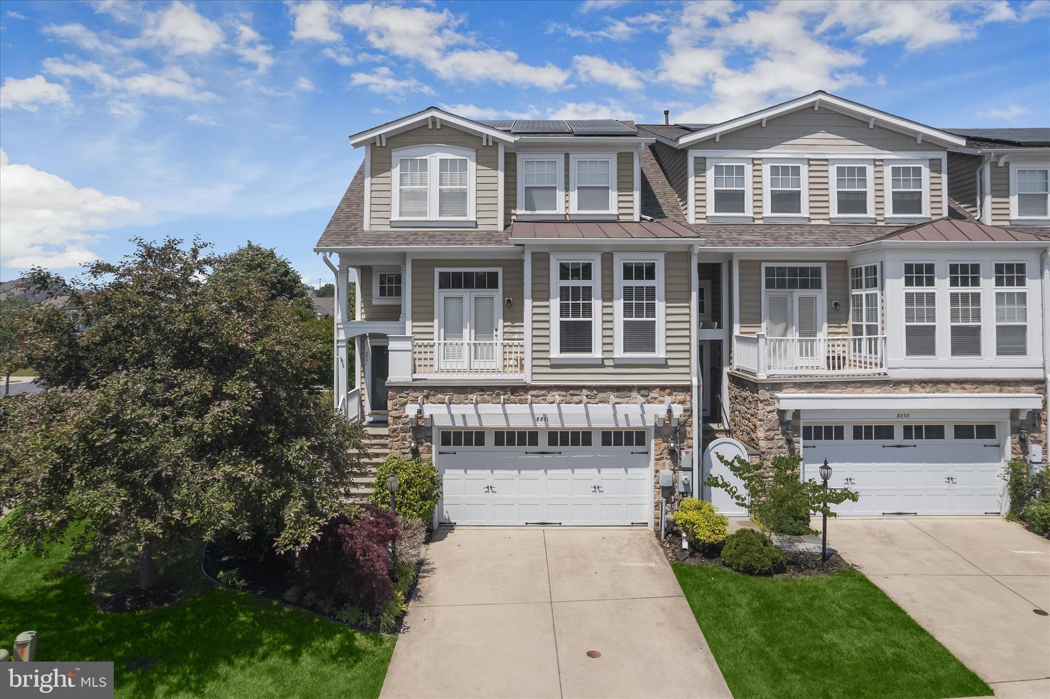 Set within the gated Stone Lake community, this end-unit townhome offers more than 3,500 square feet of refined living surrounded by one of the area’s most distinctive settings. Beautiful landscaping, multiple outdoor living spaces, two fireplaces, and sweeping views of the grassy common area and mature trees create a peaceful backdrop for this former model home, while the community’s private 25-acre lake, beach, boathouse, fishing areas, boat slips, pavilion with outdoor fireplace, and recreation amenities bring a rare resort-style atmosphere to everyday life.
Inside, hardwood flooring and crown molding extend throughout much of the home, adding warmth and continuity across the expansive layout. The main level is designed for both entertaining and comfortable daily living, centered around a spacious kitchen with abundant cabinetry featuring undermount lighting, soft-close drawers, roll-out shelving, granite counters, a large island with seating, a pantry, and an adjoining breakfast area. Just beyond, the family room is filled with natural light from transom windows and anchored by the first fireplace, with direct access to the deck with retractable awning for effortless indoor-outdoor living. A formal dining room enhanced by elegant mirrored paneling, a welcoming living room off the foyer, and a dedicated home office with built-in bookcases provide versatile spaces suited for both gatherings and quiet moments. A powder room concludes the level.
Upstairs, the primary suite offers a private retreat with a tray ceiling, its own deck, a generous walk-in closet, and an en suite bath featuring a double sink vanity, soaking tub, and tiled shower with a frameless glass door. Two additional bedrooms share a full bath with another double vanity, while a conveniently located laundry room completes the upper level.
The finished lower level expands the home even further with a spacious recreation room centered around the second fireplace, creating an inviting setting for movie nights or game days. An atrium door leads outside to the stone paver patio where a bench swing overlooks the surrounding greenery. This level also includes an optional fourth bedroom, a half bath, and interior access to the oversized garage with abundant storage and workshop space.
Beyond the home itself, Stone Lake delivers an exceptional lifestyle with tennis and pickleball courts, playgrounds, baseball fields, scenic trails, and lakeside gathering spaces, all within a gated setting with 24-hour security and convenient access to I-95, Route 32, Maple Lawn, and nearby shopping and dining. Please note: some photos have utilized virtual staging.