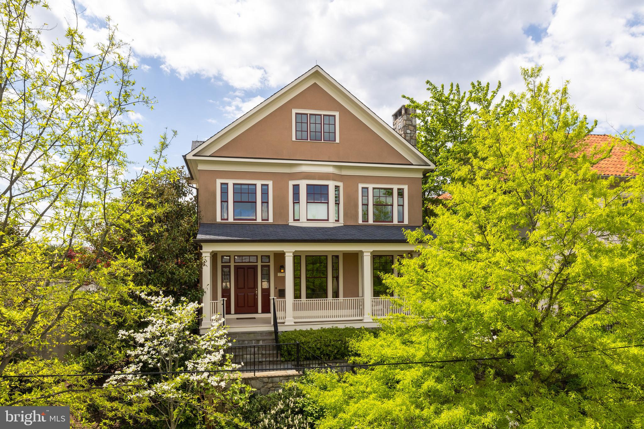 Spacious and rarely available recently built home in DREAM Cleveland Park location backing to the Rosedale Conservancy and steps to multiple schools and Cathedral Commons! Featuring grand-scale rooms, tall ceilings, and spectacular southern light throughout and with dramatic Cathedral and Monument views from its large backyard and multiple porches. Main level features elegant foyer, living room with fireplace, large dining room, and large open kitchen/family room with fireplace, mud room, and screened porch. Upstairs is a large owner suite with 2 dressing rooms, luxurious bath, and private balcony, plus four additional bedrooms, three additional bathrooms, 3rd floor loft with porch, and laundry room. Finished lower level with 9'4" ceilings features large family room, additional bedroom/bath, storage, and garage with dumbwaiter to mud room. Private, flat back yard with patio, screened porch, and shared tennis court!