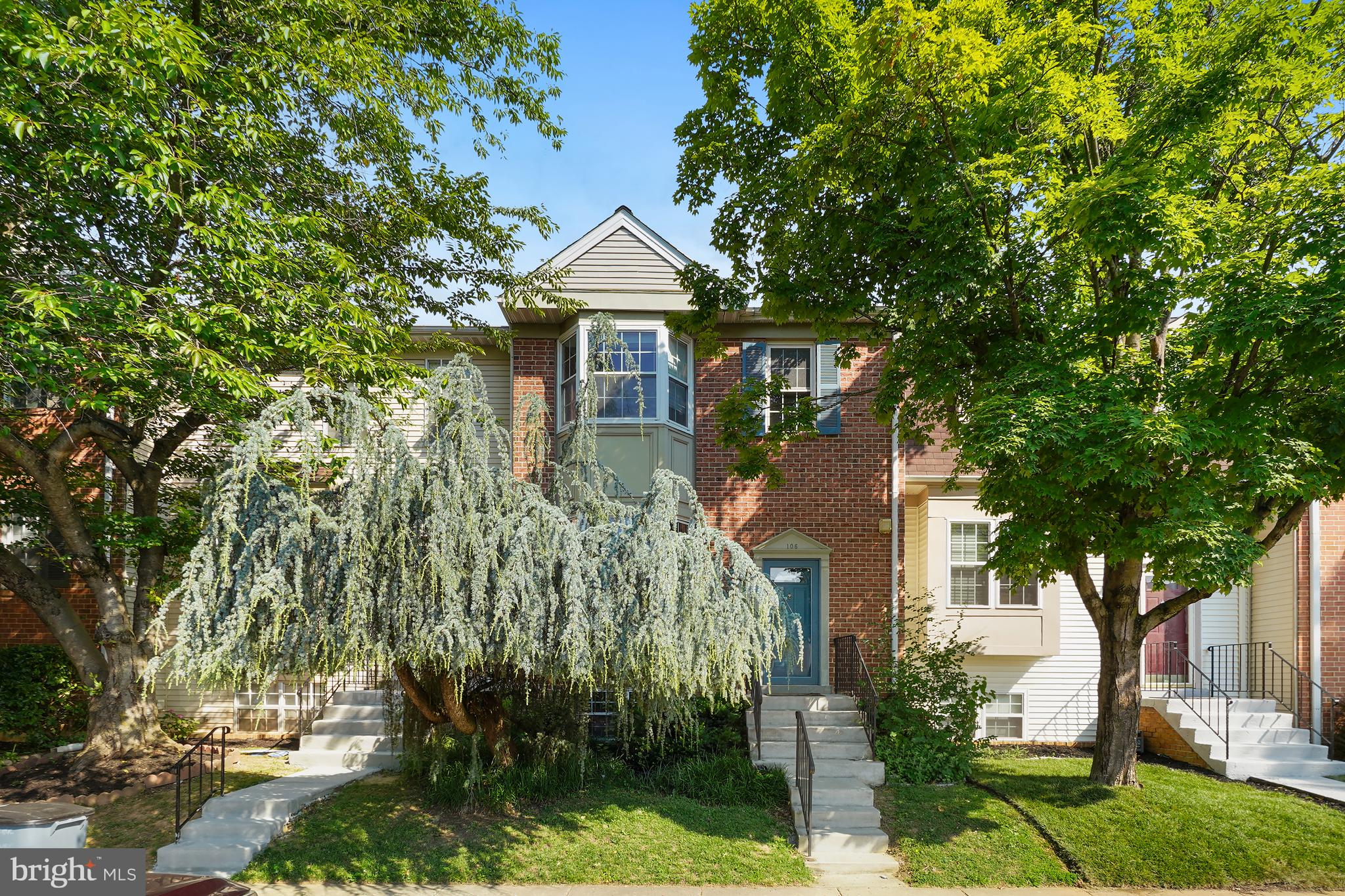 Welcome to 106 Autumn Flower Lane, a beautifully maintained three-level townhouse in the sought-after Amberfield community.  Step inside and be greeted by the spacious living room, highlighted by a charming bay window with a built-in window seat overlooking the picturesque front weeping tree. The main level continues into a large eat-in kitchen with ample space for casual dining and direct access to the rear deck perfect for entertaining or enjoying your morning coffee. A convenient powder room completes this level.
Upstairs, you'll find the primary suite featuring an en-suite bath, along with two additional bedrooms and a full hall bath.  The walkout lower level offers a generous family room with a cozy gas fireplace, a fourth bedroom, and a full bath, providing flexible living space for guests, a home office, or recreation. From this level, step outside to the fenced backyard, ideal for outdoor enjoyment.  Amberfield residents enjoy an exceptional array of community amenities, including a swimming pool, tennis courts, open green spaces, and playgrounds. Conveniently located close to shopping, restaurants, and major commuter routes, this home offers the perfect combination of comfort, convenience, and community living.