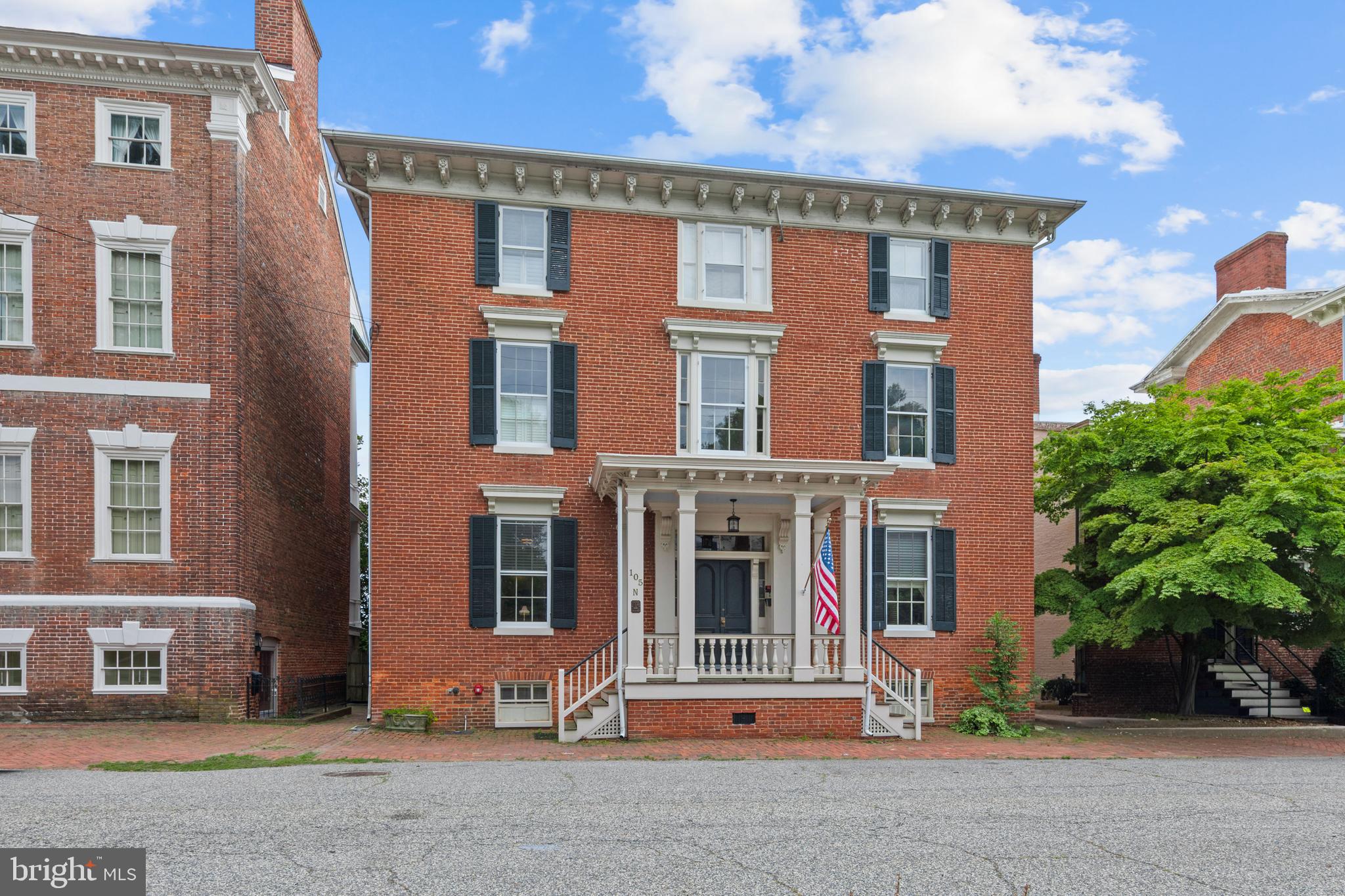 Located on Water Street in the heart of Chestertown's premier waterfront historic district, this beautiful two-bedroom, two-bath condominium offers an exceptional opportunity to enjoy life along the banks of the Chester River. Set within an architecturally significant 1800s building that reflects the timeless character of this remarkable town, the residence combines historic charm, modern comfort, and an enviable waterfront location. Filled with character and warmth, the home features beautiful hardwood floors, soaring ceilings, tall windows, built-ins, and a wonderful period gas fireplace that creates a welcoming focal point in the spacious living room. Two generously sized bedrooms and two beautifully appointed tiled bathrooms provide comfort and style, while an in-unit washer and dryer add everyday convenience. Generous room sizes and abundant natural light enhance the home's inviting atmosphere throughout. The heart of the home is the expansive kitchen and great room at the rear of the residence, overlooking the river. Designed for gathering, entertaining, and everyday living, this impressive space features gorgeous cabinetry, stainless steel appliances, gas cooking, abundant counter space, a farmhouse sink, sunny windows, and plenty of room for dining as well as additional living space. Whether hosting friends, enjoying a quiet morning coffee, or unwinding at the end of the day, it's a room you'll find yourself gravitating toward again and again. Just off the great room, the private balcony overlooks the Chester River and offers sweeping water views in a peaceful waterfront setting. Direct water access and a dedicated boat slip make it easy to enjoy the area's iconic Chester River and everything that life on the water has to offer. Chestertown is steeped in maritime tradition and widely admired for its extraordinary collection of Federal, Georgian, and Victorian architecture. One of the Eastern Shore's most desirable destinations, residents enjoy boutique shopping, fine dining, waterfront attractions, cultural events, and a thriving arts scene. Perfectly positioned along the Chester River, this residence is a historic treasure, a waterfront retreat, and an opportunity to experience the very best of life in one of the Eastern Shore's most cherished communities.