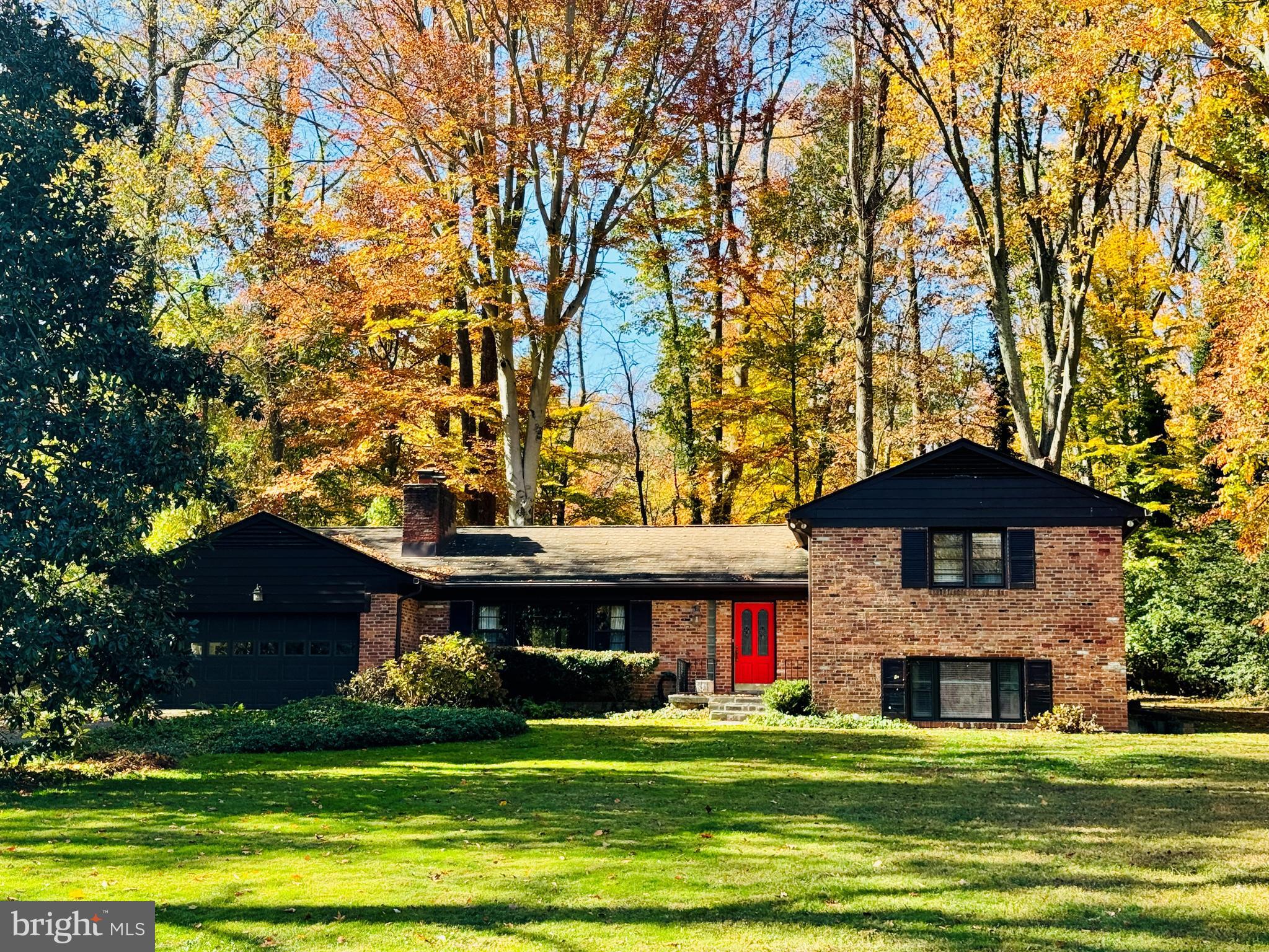 Quality-built all brick split-level home on 0.71 acres in Mantua. Over 3,750 finished square feet. this home is situated in a prime location in the neigbhorhood; a beautiful street comprised of larger lots and just a few yards from the entrance to Eakin Park.   Tastefully updated throughout and well maintained.  Kitchen is open to gorgeous family room addition that is  full of natural light and custom built-in shelving, as well as a wood burning stove.  Separate banquet size dining room.  Elegant living room  with wood burning fireplace. Spacious bedrooms and updated baths on upper level.  The primary suite has a delightful sitting area and custom built in cabinets.  The updated primary bathroom has double sinks and a large soaking tub, new quartz countertop.  The recently renovated  hall bathroom has double sinks also. Huge rec room on lower level with walk up door to side.  Wood burning fireplace and a wall of custom cabinets as well as a built in desk area.  This lower level contains a third full bath, laundry room and a large 4th bedroom/guest suite.  This home is a rare offering  on a beautiful level lot fringed by trees. The exterior flagstone patio looks over an expansive lawn area and is a nature sanctuary full of birds and wildlife. Trails and park nearby- Eakin Park has 2 public tennis courts, basketball court and tot lot.  Mantua Swim and tennis club within the neighborhood has active adult and kid swim and tennis programs plus pickle ball!  This home has a membership that is available for purchase to the buyer - avoid the long wait list. Woodson HS. Close to Mosaic shopping center, Fairfax Hospital, Beltway access and major highways.  Dunn Loring and Vienna Metros close by.