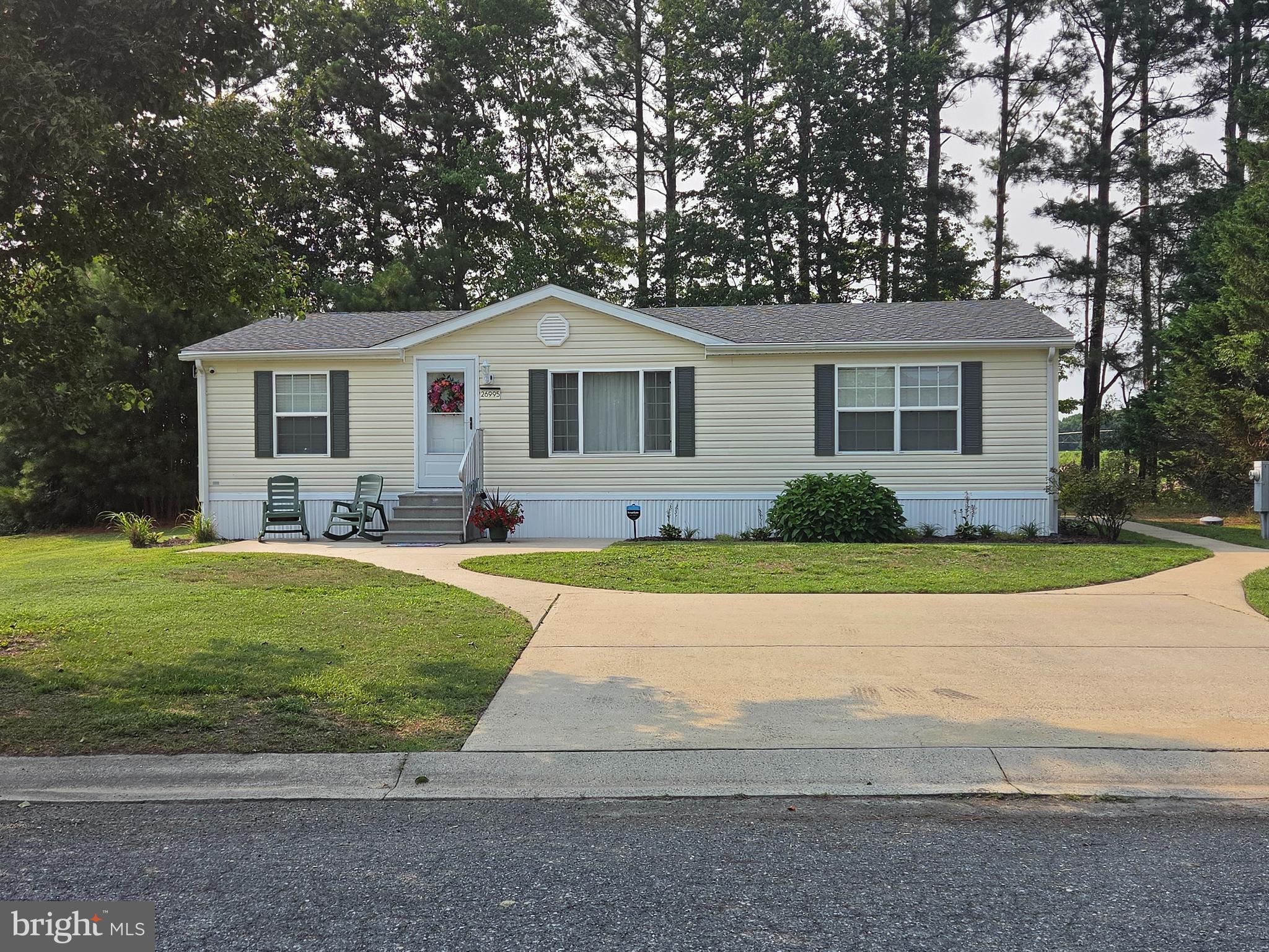 Welcome home to low maintenance living in tranquil Hebron Woods. As you arrive you will notice convenient off street parking on the concrete driveway that flows to sidewalks leading to both entrances and a concrete patio. This immaculately maintained double wide features many fresh upgrades such as LVP flooring and fresh carpet in the bedrooms. The kitchen is  chef ready and beautifully updated with all stainless steel appliances and a gas range to go along with butcher block counters. With 3 bedrooms and 2 full baths, this smartly designed home has optimized the available square footage.