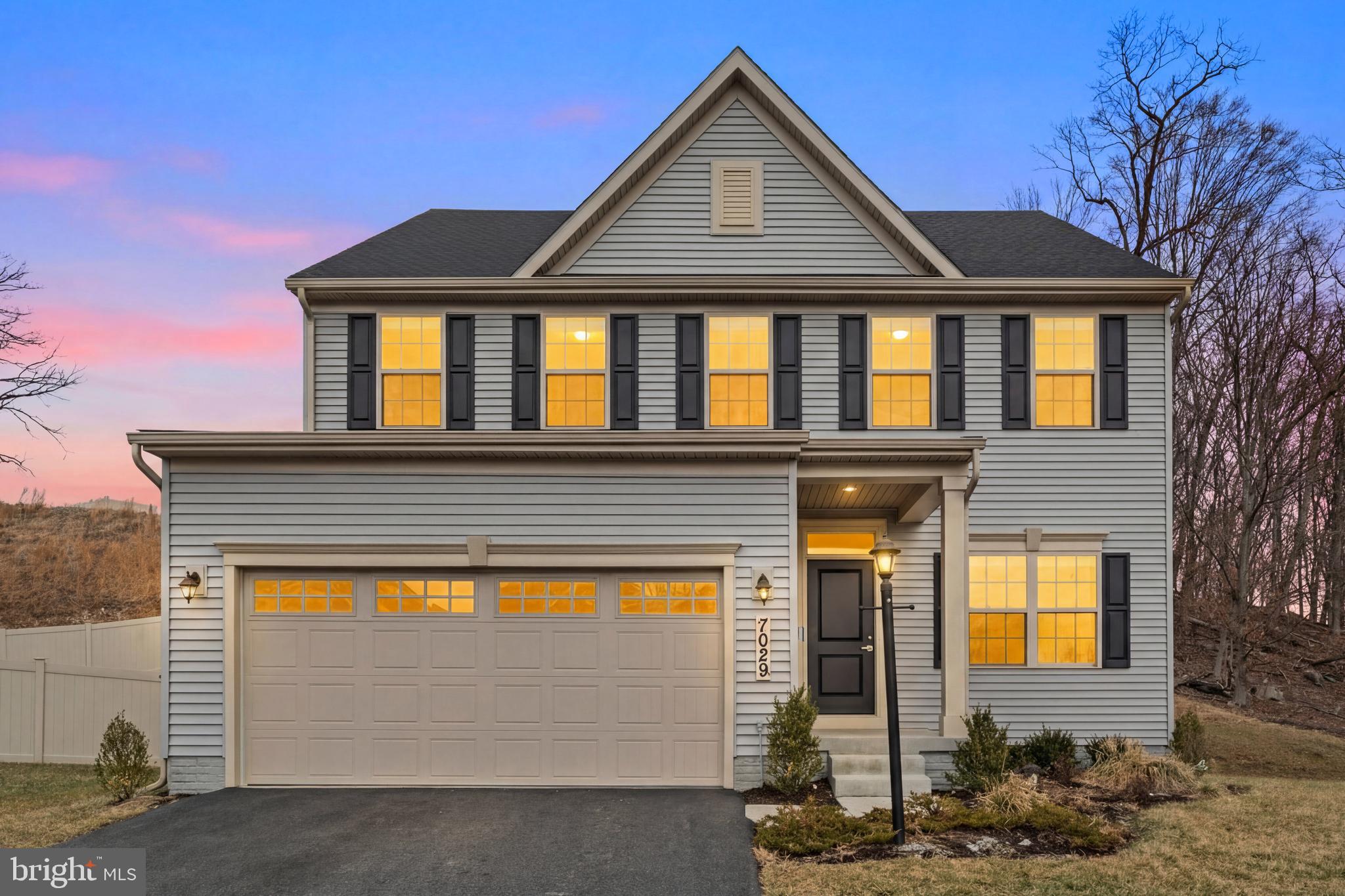 Welcome to this stunning 2023-built home in sought-after Lake Linganore—where lifestyle and luxury come together. Perfectly positioned on a quiet street with easy access to multiple neighborhood trails, this home offers peaceful wooded views and the ease of golf cart living in an amenity-rich community.

The sunlit open floor plan showcases LVP flooring, a cozy gas fireplace, motorized blinds, and designer finishes throughout. The gourmet kitchen is truly the heart of the home, featuring an oversized island, custom cabinetry, stainless steel appliances, and a built-in microwave—ideal for everyday living and entertaining alike. The second level hosts four spacious bedrooms and two full baths, along with the added convenience of upper-level laundry.

The luxurious primary suite features a tray ceiling, a spa-inspired bath with double vanity, a walk-in shower with dual showerheads, and a generous walk-in closet.

The finished basement expands your living space with a large recreation room, fifth bedroom with walk-in closet, full bath, and an expansive unfinished storage area perfect for a home gym, art studio, or craft room. Rough-in plumbing offers future customization potential.

Living in Lake Linganore means enjoying private beaches, multiple swimming pools, lakes for fishing and boating, tennis and pickleball courts, playgrounds, food trucks, farmers markets, concerts, and miles of scenic hiking and golf cart trails. Walk to Lake Merle, the new elementary school, and nearby community amenities. Conveniently located just minutes from downtown Frederick and major commuter routes including I-70, I-270, 15, and 340, and approximately six miles to the MARC Frederick train to DC, this home offers both tranquility and accessibility. The new Linganore Town Center opening soon will add even more shopping and dining options nearby.

Additional highlights include a two-car garage with arrival center and updated lighting throughout. This home truly checks every box for comfort, convenience, and lifestyle.