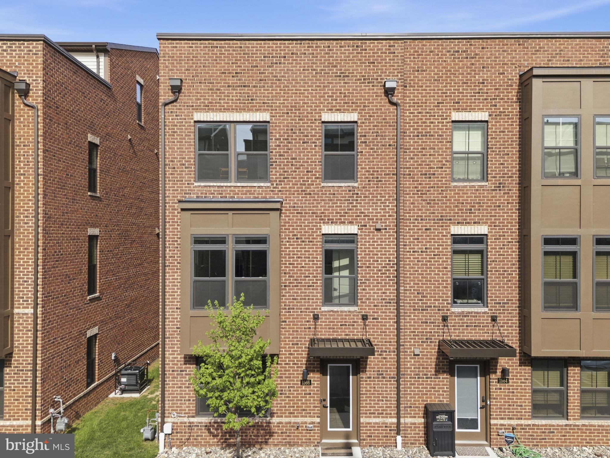 Welcome to Banner Row, Locust Point’s premier townhome community. If you’ve been searching for generous living space, effortless parking, and a prime location in the heart of Locust Point, this is the one.

Pull directly into your two-car garage, complete with EV charging, and enjoy convenient entry into the first level of the home. This floor also offers additional storage and versatile flex space, ideal for a home office, gym, or bonus living area.

The main level features an open-concept layout designed for modern living. An oversized kitchen with a large island flows seamlessly into the bright and spacious living room, making it perfect for entertaining. You’ll also find a convenient half bath, a sizable dining area, and access to your private balcony, perfect for morning coffee or evening grilling.

As a sought-after end unit, this home is filled with natural light from three sides and offers added privacy. Upstairs, the primary suite features a large walk-in closet and a spacious ensuite bath with dual vanities and a walk-in shower. Two additional bedrooms, a full hall bath, and laundry complete the third level.

The top floor loft provides even more flexible living space, along with a full bath—perfect for a guest suite, media room, or second office. Best of all, it opens to your private rooftop terrace, ideal for summer nights with water views. With no neighboring rooftop terrace attached on one side, this end-unit location offers an extra sense of privacy.

This home is truly move-in ready, with pristine condition of over 2,200 sq. ft. and custom window treatments throughout.

Enjoy a highly walkable lifestyle just moments from McHenry Row, where groceries, gyms, salons, and popular restaurants are right nearby. You’re also conveniently close to Federal Hill, Baltimore Peninsula, and some of the city’s best attractions—including Fort McHenry, National Aquarium, Oriole Park at Camden Yards, and M&T Bank Stadium.

Combining modern design, functional space, and an unbeatable location, this is city living at its finest.