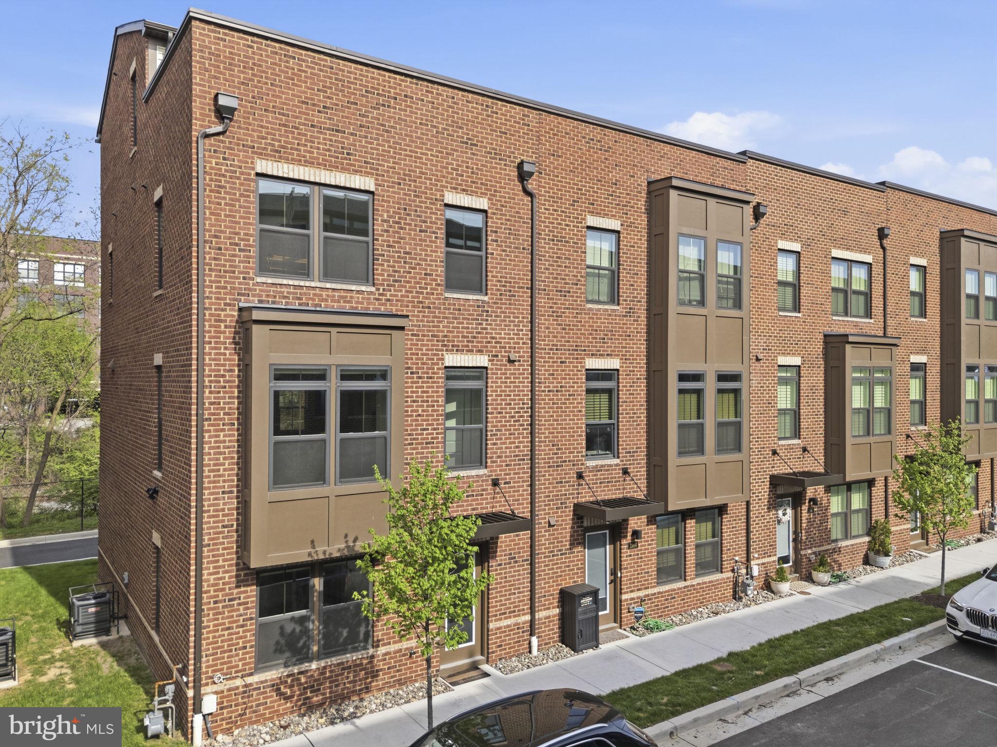 Welcome to Banner Row, Locust Point’s premier townhome community. If you’ve been searching for generous living space, effortless parking, and a prime location in the heart of Locust Point, this is the one.

Pull directly into your two-car garage, complete with EV charging, and enjoy convenient entry into the first level of the home. This floor also offers additional storage and versatile flex space, ideal for a home office, gym, or bonus living area.

The main level features an open-concept layout designed for modern living. An oversized kitchen with a large island flows seamlessly into the bright and spacious living room, making it perfect for entertaining. You’ll also find a convenient half bath, a sizable dining area, and access to your private balcony, perfect for morning coffee or evening grilling.

As a sought-after end unit, this home is filled with natural light from three sides and offers added privacy. Upstairs, the primary suite features a large walk-in closet and a spacious ensuite bath with dual vanities and a walk-in shower. Two additional bedrooms, a full hall bath, and laundry complete the third level.

The top floor loft provides even more flexible living space, along with a full bath—perfect for a guest suite, media room, or second office. Best of all, it opens to your private rooftop terrace, ideal for summer nights with water views. With no neighboring rooftop terrace attached on one side, this end-unit location offers an extra sense of privacy.

This home is truly move-in ready, with pristine condition and custom window treatments throughout.

Enjoy a highly walkable lifestyle just moments from McHenry Row, where groceries, gyms, salons, and popular restaurants are right nearby. You’re also conveniently close to Federal Hill, Baltimore Peninsula, and some of the city’s best attractions—including Fort McHenry, National Aquarium, Oriole Park at Camden Yards, and M&T Bank Stadium.

Combining modern design, functional space, and an unbeatable location, this is city living at its finest.
