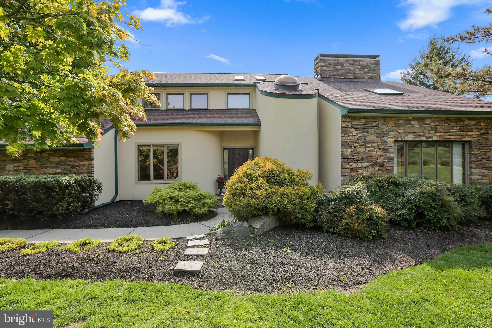Open House, Wed. May 11th from 1 pm to 3pm ! Spectacular contemporary home in the gated community of Overlook! This 5 bedroom, 3.5 bath home sits on a gorgeous 2.2 acre lot with upgrades throughout.  Open floor plan with stack stone double sided fireplace between the living room and family room. Gourmet kitchen with white shaker cabinets with inset doors, six burner range with pot filler, two dishwashers, wine fridge, quartz counters and kitchen island with pendant lights. Sliders to Ipe Wood deck overlooking a custom built pool with waterfall and fountains. Second floor loft area currently being used as a home office with a double sided stacked stone fireplace overlooks the living room. Primary bedroom with stacked stone fire place, cathedral ceiling, sliders to a Juliette balcony, two walk-in closets, en suite bath with separate shower, soaking tub, double vanity and sky light. Three good sized additional bedrooms on upper level and hall bath. Lower level has a wall of sliders for plenty of natural light, rec room and stone hearth for a wood or pellet stove. Bedroom and full bath in lower level. Patio off lower level with hot tub and steps to access the lower portion of the property. Level area has been used for plenty of lacrosse practices and a perfect fire pit for entertaining. This is a fabulous property in a great neighborhood!