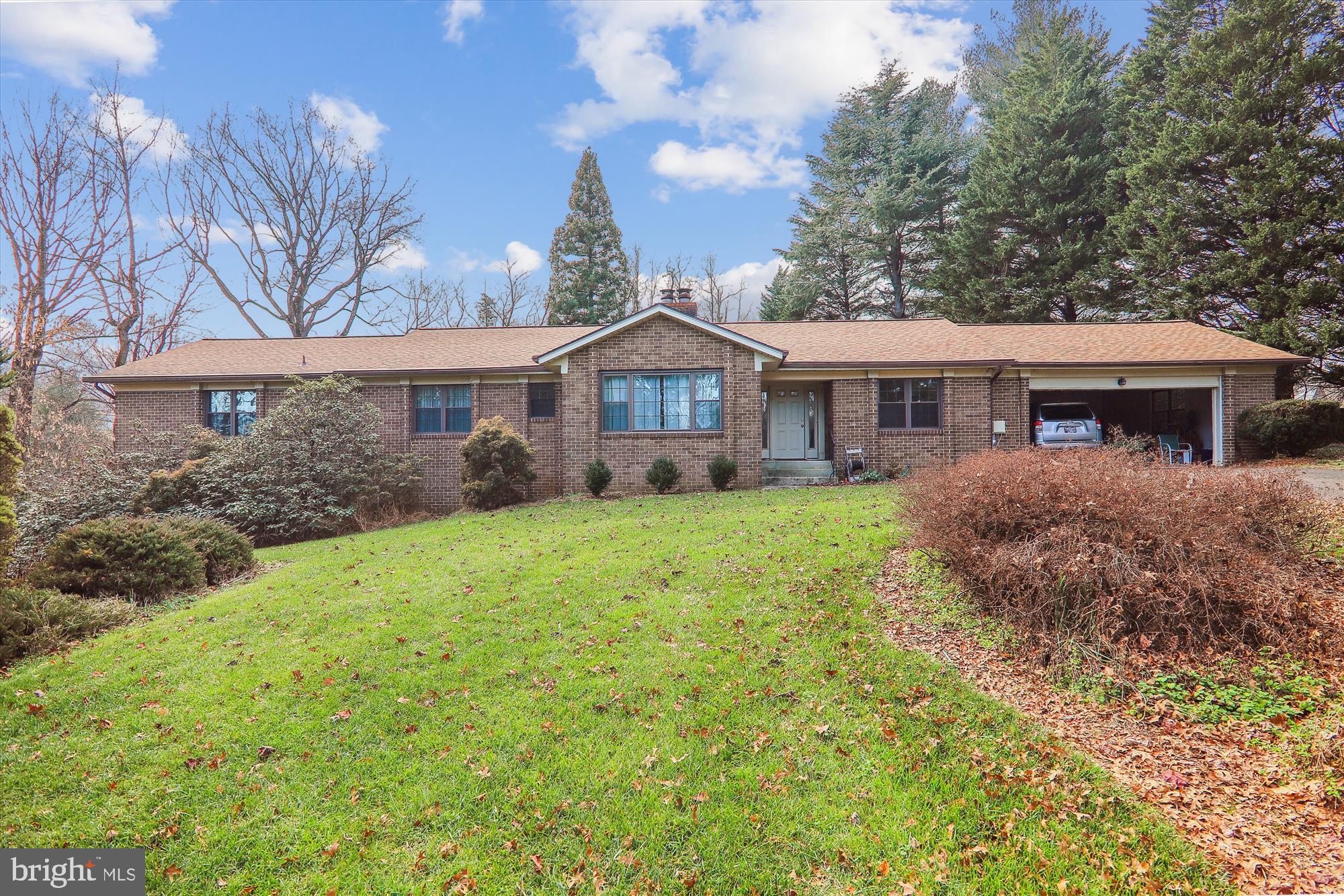 Privately located custom brick rambler on 4+ acres with over 4000sqft of living space.  Home has 4 large bedrooms and 2.5 bathrooms. The master bedroom suite has a large soaking tub, separate shower and double sinks.  All  of the bedrooms have large closets. The family room and living room  each have  fireplaces and the family rooms walks out to the deck overlooking your acreage.  The home also has a full basement.  New hot water heater, new windows and roof is less than 5 years old.  Home just needs TLC.  Very nice home but sold AS IS.  Call for an appointment