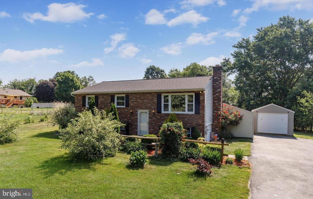 Welcome to 3500 Lawndale Rd in Reisterstown, MD 21136. This charming split-foyer home offers a comfortable layout with numerous updates throughout. The lower level features a cozy family room highlighted by a wood-burning brick fireplace—perfect for relaxing on cooler evenings. This level also includes a spacious bedroom, a full bathroom, and a dedicated laundry room, making it ideal for guests or extended living.

Upstairs, you’ll find a bright and inviting main living area enhanced by ceiling fans and durable LVP flooring. A newer front entrance door adds to the home’s fresh appeal, while the three-year-old heat pump provides efficient heating and cooling year-round. The recently remodeled gourmet kitchen showcases modern gray cabinetry, granite countertops, stainless steel appliances, and a stylish mosaic tile backsplash.

All upper-level bedrooms feature new carpeting, and the entire upstairs has been freshly painted, creating a clean, modern feel. Just off the kitchen is a charming 10x12 sunroom, offering a peaceful space to unwind. Step outside onto the recently redone deck—wired and ready for a hot tub—ideal for entertaining or enjoying quiet evenings outdoors.

The property offers ample parking with a private driveway, a spacious garage built just three years ago, and two sheds for additional storage. The in-ground pool has been relined and includes a new pump, ready for summer enjoyment. Mature trees and garden space surround the home, providing privacy and a serene outdoor setting.

Don’t miss the opportunity to make this beautifully updated home your own.