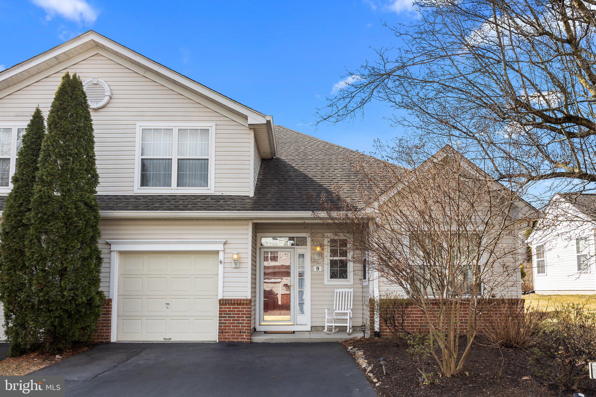 Welcome to 9 Black Eyed Susan Road in the desirable 55+ Community of Flowers Mill! Upon entering through the covered front patio, your eyes will be drawn to the hardwood floors and high ceilings. You will want to start your tour in the fully updated kitchen which features modern, white 42" cabinets, granite countertops, stainless steal appliances, pantry and large island. You will love the bright breakfast nook with plenty of natural light.  Off the kitchen you will find a combination living room / dining room with vaulted ceilings and access to the paver patio with beautiful landscaping for privacy ready to bloom this spring.  Also to be found on the main floor is the primary bedroom with en-suite, and 3 closets! A nicely sized walk-in closet, an additional clothing closet as well as a linen closet. Finishing out the first floor is the laundry, conveniently located near the main bedroom, a powder room and access to the 1-car garage. Upstairs you will find the second bedroom with it's own full bath, perfect for an office or guest room and big enough for both, as well as the utility room which offers space for storage. Of Note: Roof (2018), HVAC (2020) Water Heater (2020). Enjoy all the activities that Flowers Mill has to offer including clubhouse, indoor pool, outdoor pool, tennis courts, bocce, pickle ball courts, walking trails and a calendar full of events.