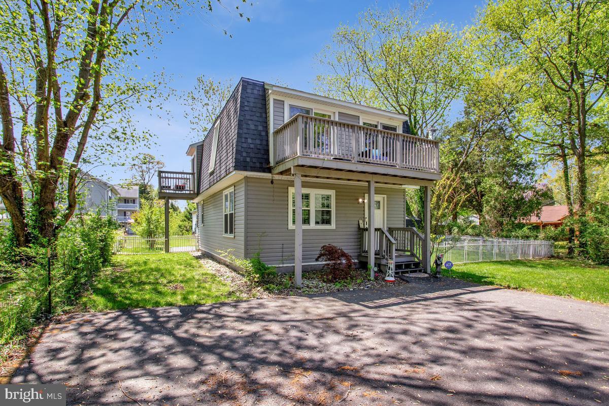 Coastal Affordable Living with a Boat Slip Included Discover the charm of Snug Harbor, where coastal living meets everyday affordability. This beautifully updated home offers gorgeous Chesapeake Bay views and the rare bonus of an included boat slip — making waterfront living more accessible than ever. Inside offers a light-filled floorplan, wide open living room, an open kitchen shines with upgraded appliances, modern cabinetry, and beautiful hardwood floors, creating a bright and inviting space for cooking, gathering, and unwinding. Step out onto the large deck  for effortless entertaining, with plenty of parking for guests.  Two sheds!  Vinyl fenced in flat back yard!  Wake up to sunrise views from the upper level decks or take a short stroll to the community dock for a peaceful moment by the water. This water privileged neighborhood is perfect for year round living or a budget friendly bayside retreat. Launch your kayak or boat for days on the Bay, explore nearby marinas and yacht clubs, or enjoy local waterfront restaurants, dock bars, and scenic parks. Conveniences along Shady Side Road and Snug Harbor Road keep daily life simple, and commuting to D.C., Andrews AFB, or Annapolis is a breeze. This home conveys as a “Marina Association Slip Holder Member,” giving you full access to the revitalized marina and boat ramp.