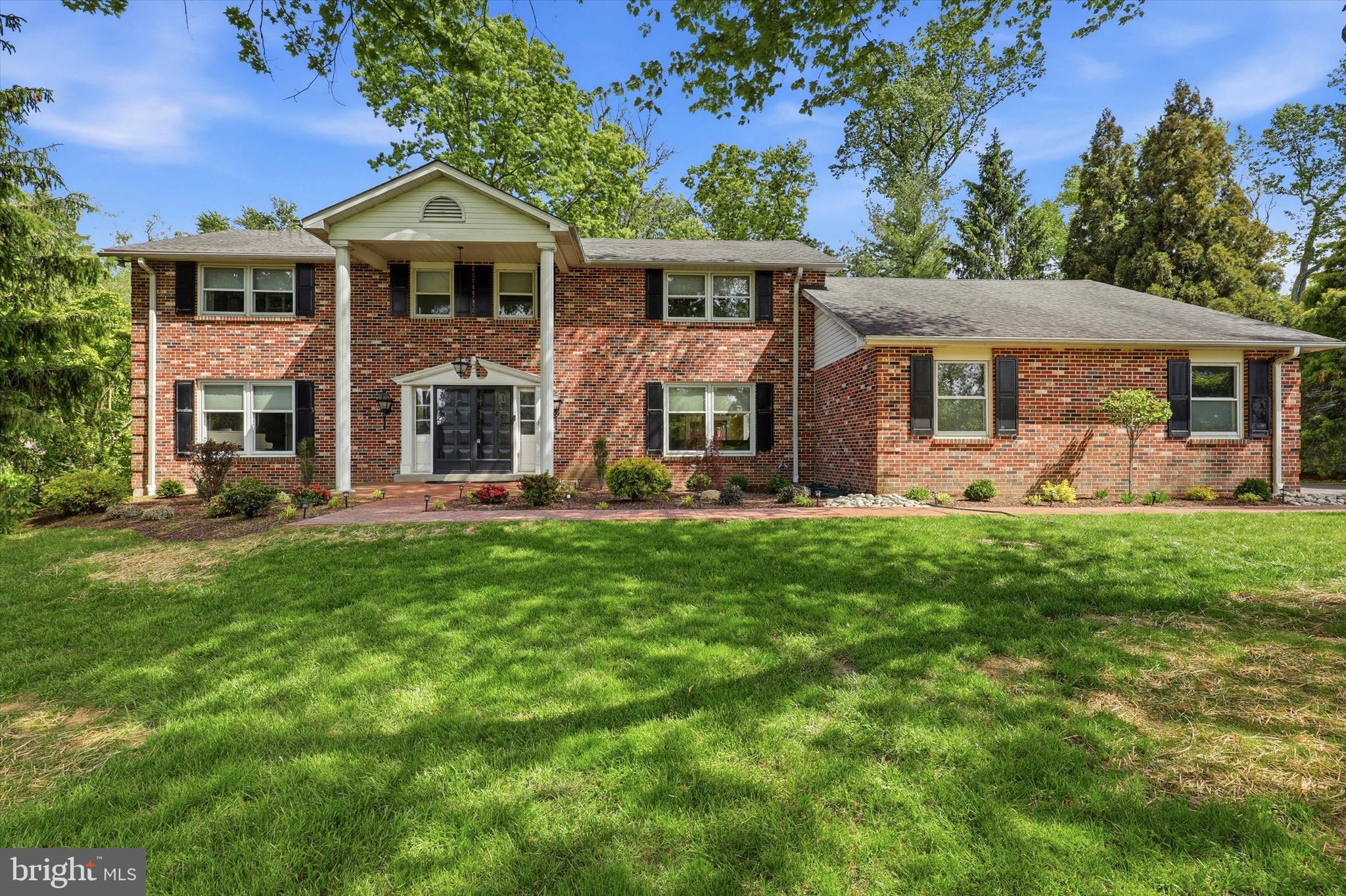 This fantastic 5 bedroom, 3.5 bath traditional style move in ready home is where classic character meets modern scale. From the moment you step through the double front doors into the large open foyer, you’ll notice this isn't your average floor plan—it’s a home designed for both effortless entertaining and quiet daily life. The main level offers an incredible flow. To one side, a massive game room or formal living area features elegant French doors and sleek hardwood floors. Nearby, a dedicated home office provides the perfect quiet retreat for remote work. The heart of the home is undoubtedly the dining room, where a wood-burning fireplace with a brick surround and a beamed ceiling create an atmosphere that's both rustic and refined and provides access to the fabulous screened in porch which provides additional living space.  For the chef, the kitchen is a total standout. Anchored by a massive quartz island and breakfast bar, it’s equipped with stainless steel appliances, a built-in wine fridge, and a deep window that floods the space with light and over looks directly into a sun-drenched den. Conveniently located off the kitchen is the practical laundry/mudroom that keeps the two-car garage and backyard access tucked neatly away. Upstairs, the primary suite serves as a true sanctuary, featuring a custom-outfitted walk-in closet and a recently redone bath complete with a pebble-floor stall shower. Four additional generously sized bedrooms—all with hardwoods and great natural light—ensure plenty of space for family, guests, or hobbies. Not to be forgotten are the two additional full baths and attic space that is perfect to additional storage or finishing for more living space. The finished basement is a game-changer, offering a massive 49x24 recreation area, a dedicated gym space, and a bonus area perfect for a theater or craft studio. Outdoor living here is a dream. Spend your summers on the large screened-in brick patio with its soaring raised ceiling, or move to the secondary side patio for grilling. All of this overlooks a sprawling, private lot that feels like your own personal park. A bridge at the back of the property  provides convenient walking access into the neighborhood and is great for daily use. Located in a fantastic neighborhood with sidewalks leading directly into Executive Estates, this home offers the perfect blend of privacy and community. Close proximity to shopping, restaurants and major highways as well as parks and trails! It’s the kind of place where memories are made—come see it for yourself.