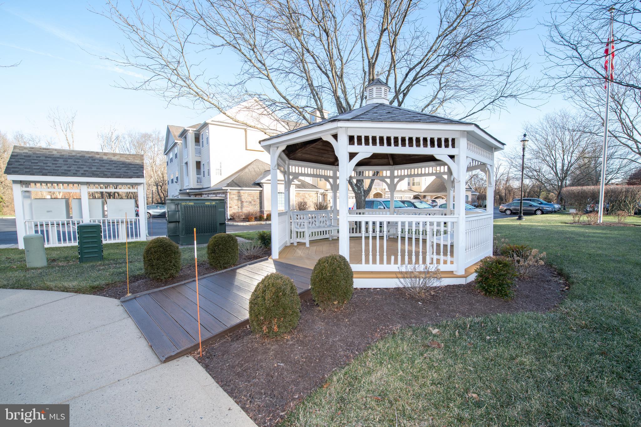You won't be disappointed with beautiful 2 bedrooms, 2 full baths condo  in the desirable and rarely offered Holland Preserve 55 + community.   In this lovely unit you'll find a convenient entry hall with hardwood floors,  coat closet and large double door laundry closet with newer washer/dryer included as is.   The spacious living room has sliding glass doors to a good sized balcony overlooking  a  tranquil wooded area, a perfect spot to enjoy your morning coffee.  There is a formal dining room for your holiday meals or  where you can entertain your quests in style .   The kitchen has a brand new stainless steel gas stove and  built-in microwave and a brand new stainless steel dishwasher,  wood cabinets,  peninsula , double door pantry and a large eat-in area.   The oversized primary bedroom has multiple windows, ceiling fan and 2 walk-in closets. The huge attached primary bath has a double sink vanity, large stall shower with glass doors and a linen closet.   Bedroom 2 has a ceiling fan and large closet.  The hall bath has a vanity sink and tub/shower. Additional features:  One car attached garage with inside access; new HVAC;  storage/heater closet located on the balcony; convenient yet private location nestled off the beaten path but  close to shopping and  restaurants;  well appointed & secure  lobby entrance; elevator and so much more!!   Don't miss this opportunity to own this  beautiful, affordable condo and experience care-free living at it's best!!  Make your appointment today!!   ( A one time $150.00 assessment will be due 3/1/2024)
