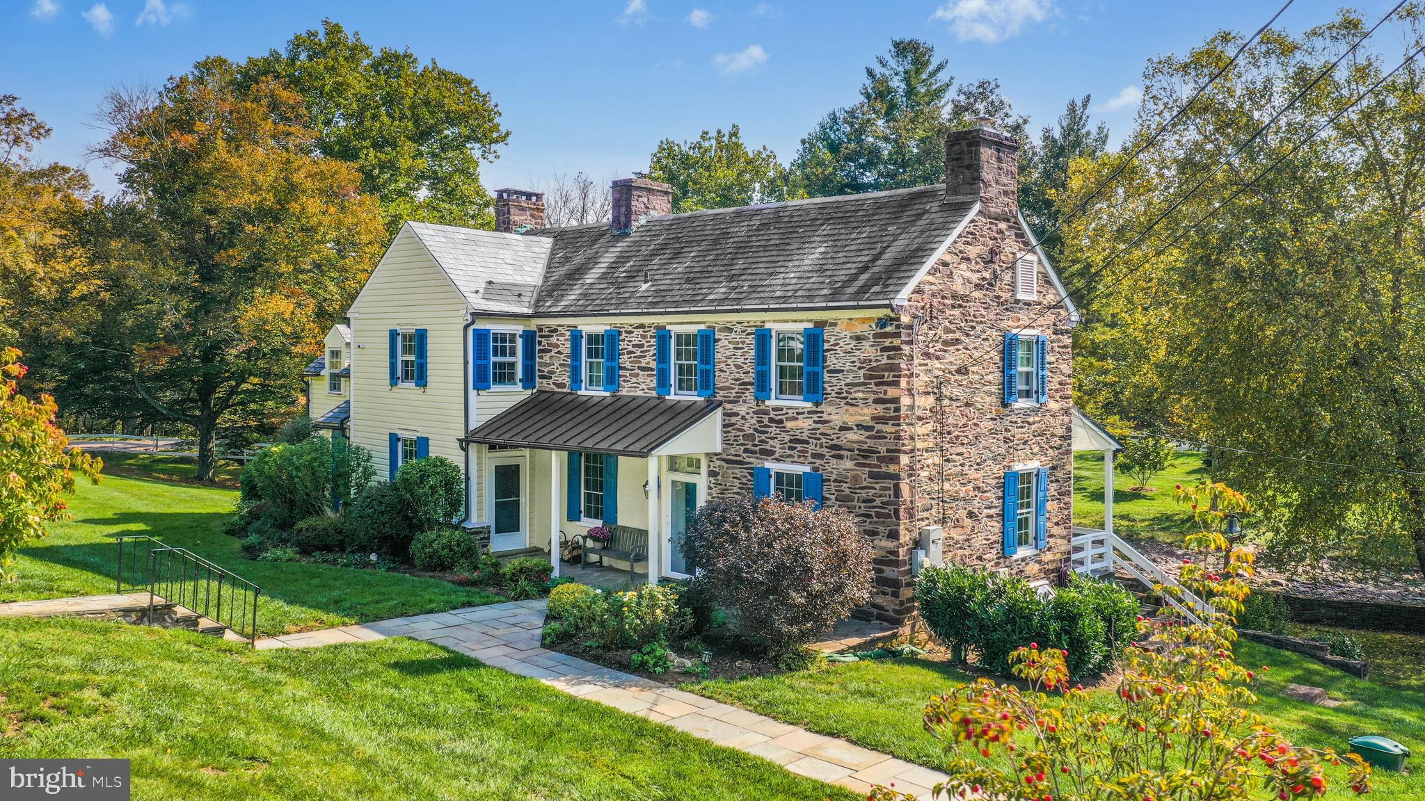 Nearly eight idyllic acres envelop this late 1700’s farmhouse, bank barn and cottage in scenic Bucks County. Once owned by William Penn’s sons, with land on both sides of the historic Loux Covered Bridge, Cabin Run was at one time a working farm, sawmill and gristmill. Today, this lovingly maintained and thoughtfully updated home is an extraordinary country estate with a magical setting.

     The stone residence offers covered porches, random width pumpkin pine floors, and windows with deep sills. Walk-in stone fireplaces accent the living and dining rooms. A beautifully remodeled kitchen impresses with granite and tile surfaces, upscale stainless appliances, and double doors to the flagstone patio, a serene vantage point to experience the beauty of Cabin Run Creek and the spectacular grounds. Geothermal heat and a propane generator are welcome amenities. Meticulously restored, the stone and wood barn includes space for vehicles, projects and hobbies. A centuries old carriage house is a charming residence of its own, nicely equipped with a full kitchen, laundry room, bedroom and bath. A bountiful orchard, in-ground saltwater swimming pool, stone sculpture garden, and abundance of mature trees and colorful plantings enhance this unique property. 

     Roads with covered bridges lead to shopping and dining along the Delaware River, and major thoroughfares are easily reachable for quick access to Philadelphia and New York City.