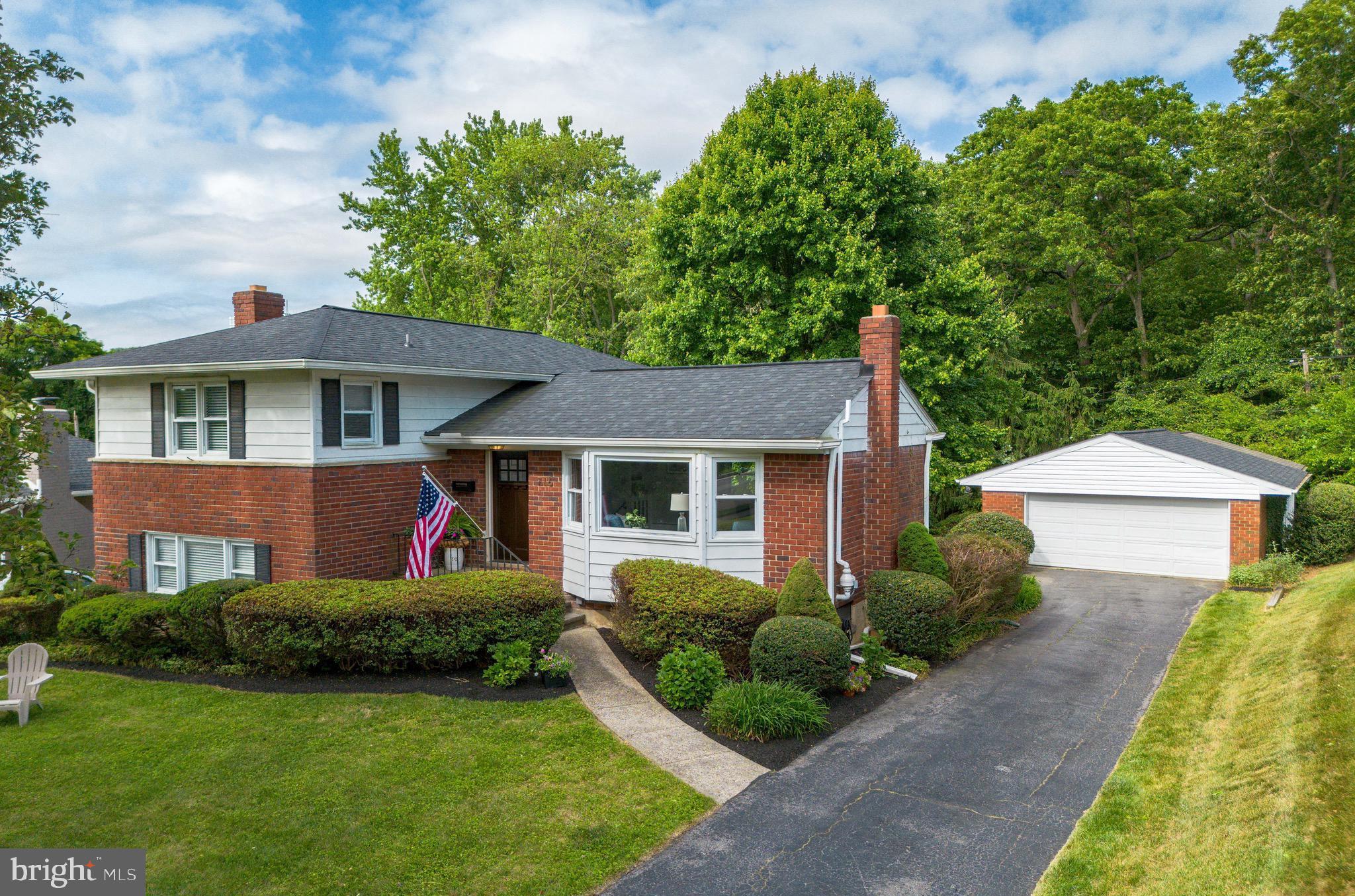 Welcome to 716 Shelly Road! This wonderful, unique 3 bed/2 1/2 bath home is nestled in the sought-after community of Campus Hills in Towson. Not only does this home have numerous updates, this stand out property boasts a DETACHED 2 car GARAGE and a 22' x 22' HOME OFFICE/BONUS ROOM with separate entrance, & newly carpeted (2023). Step inside the front door to discover a spacious and tastefully designed interior and newly refinished hardwood floors (2023)  throughout.  The living room is bathed in natural light, thanks to the large bow window overlooking the front yard and large windows providing picturesque views of the large treed backyard. The Lower level offers an awesome OPEN CONCEPT  family room with wood burning fireplace, stunning kitchen with oversized 8' x 3' island, and room for a large dining table for hosting family dinners or entertaining guests. The kitchen is a chef's delight, boasting modern appliances, abundant cabinetry, granite counters, and pantry. The Upper Level comprises three generously sized bedrooms also with refinished hardwood flooring. The primary bedroom provides a relaxing retreat with its well-appointed & recently updated (2021) en-suite bathroom and a spacious closet. Two additional bedrooms and updated hall bathroom with wainscoting, oversized vanity, and tub/shower combo with tile surround.  Finished basement/multipurpose room has ample closet storage, additional refrigerator, & laundry room with double utility sink and shelving.  The property's outdoor spaces are equally impressive. The backyard is an oasis of relaxation, featuring a well-maintained lawn & landscaping, a patio area perfect for al fresco dining, and mature trees providing shade and privacy. It is an ideal spot for outdoor gatherings or simply enjoying some quiet time. System updates include : Utica gas boiler (2021), Nest Thermostat (2021), Radon Mitigation System (2021), Rheem HVAC (2019).

716 Shelly Road offers a delightful living experience in the heart of Towson's Campus Hills community. With its inviting interior, well-designed spaces, and convenient location, this property presents an excellent opportunity to embrace comfortable and stylish living. Don't miss the chance to make this lovely, updated residence your new home. OPEN Wednesday, May 31st from 4:00 pm - 6:00 pm.  Stop in for a tour!