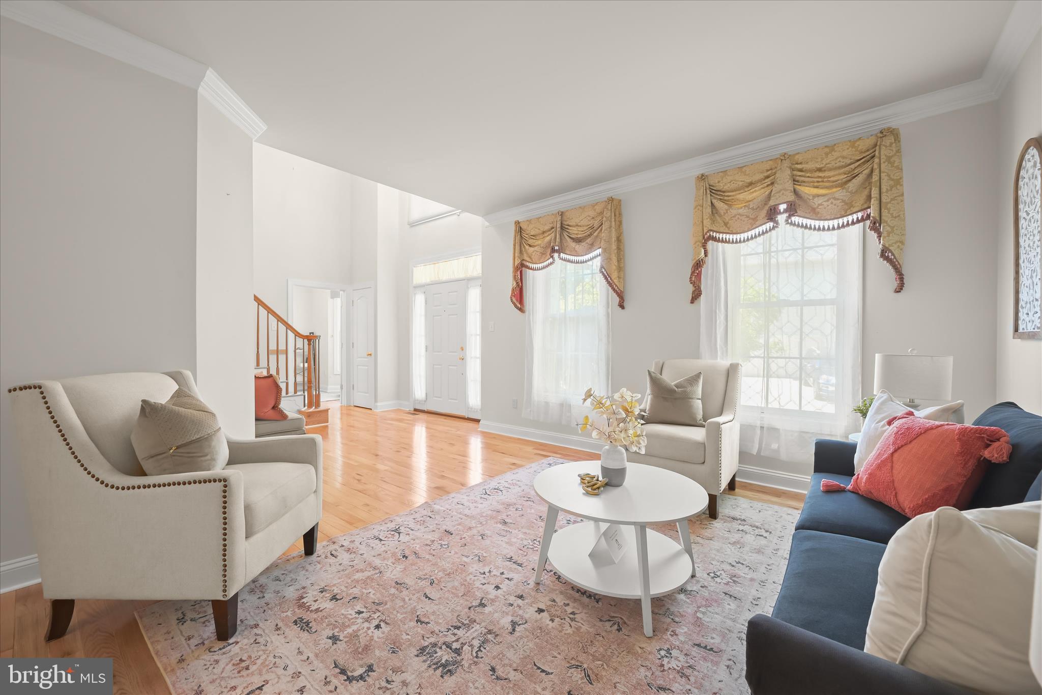 This exceptional home in the highly sought-after Emerson community offers the perfect combination of updates, space, and value. Major improvements have already been completed for peace of mind, including a new 30-year architectural roof (2025), high-efficiency RUUD HVAC system (2024), gas water heater (2022), solid oak hardwood flooring (2025), fresh paint, and a beautifully updated gourmet kitchen featuring quartz countertops, center island, stainless steel appliances, new refrigerator (2025), and new double wall ovens, microwave, and dishwasher (2026).

Designed for both everyday living and entertaining, the home offers formal living and dining rooms with an elegant tray ceiling, a dramatic two-story family room, and a main-level office with an adjacent full bath—perfect for guests or multi-generational living.

Step outside to a spacious deck overlooking a private, tree-lined backyard with direct access to community walking trails. Upstairs, the luxurious owner's suite features cathedral ceilings, a large walk-in closet, and spa-inspired bath, while three additional bedrooms provide plenty of space for family and guests.

The finished walkout lower level adds incredible flexibility with a large recreation room, two bonus rooms, and an updated full bath—ideal for a gym, media room, guest suite, or playroom.

Enjoy Emerson's resort-style amenities, including a pool, clubhouse, fitness center, tennis courts, playgrounds, and miles of scenic trails. Conveniently located near Baltimore, Washington, D.C., Fort Meade, NSA, BWI Airport, shopping, dining, and major commuter routes.

Even better—there is NO FRONT FOOT FEE! Why wait months for new construction when you can move right into a home that has already been extensively updated? This is one of the best values in Emerson and offers buyers the opportunity to be settled before the new school year begins and enjoy the remainder of summer in their new home. Homes with this level of upgrades, location, and amenities rarely become available—schedule your showing today!
