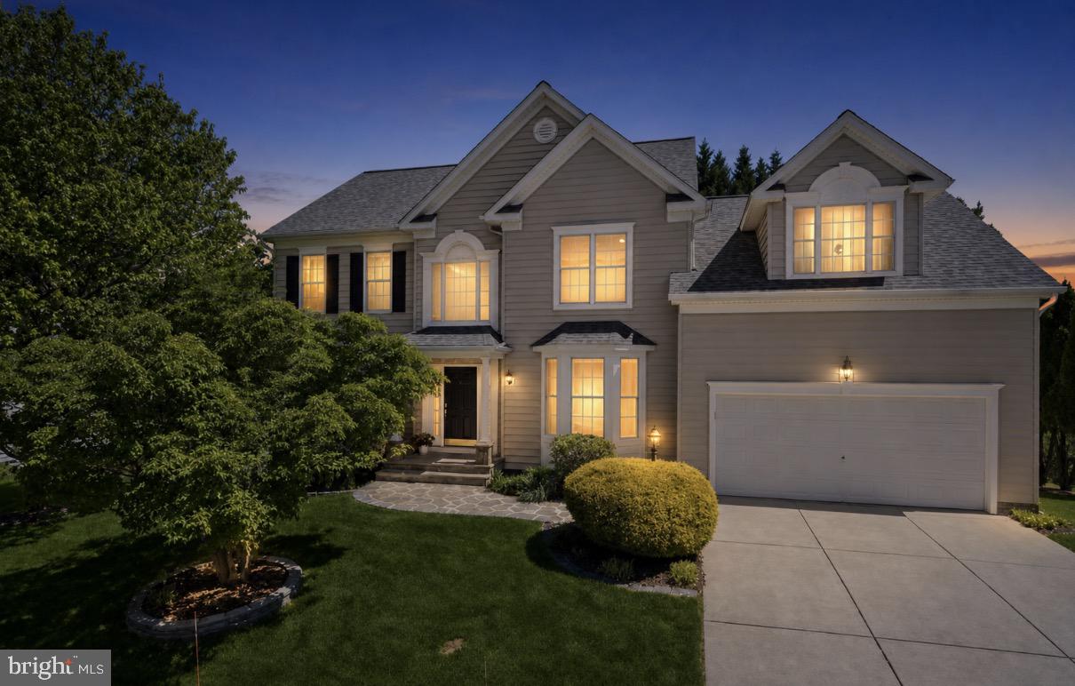 Are you Ready? Move right into a home where the major updates are already done for you, giving you the peace of mind that comes with truly worry-free living for years to come. Featuring a new 30-year architectural roof (2022), new water heater (2022), and a RUUD HVAC system with both the interior and exterior units replaced in 2024, along with countless interior upgrades throughout, this beautifully maintained home combines comfort, style, and long-term value in the highly sought-after Emerson community.

From the moment you arrive, exceptional curb appeal welcomes you with a covered stone front porch and walkway. Inside, stunning solid oak hardwood floors installed in 2025, fresh neutral paint throughout the main and upper levels, and an inviting open layout create a warm and timeless feel.

The beautifully updated kitchen is designed for both everyday living and entertaining, featuring quartz countertops, a center island, stainless steel appliances, a walk-in pantry, and extensive recent upgrades, including a new refrigerator (2025), double wall ovens, dishwasher, microwave (April 2026), faucet, and garbage disposal. The adjoining breakfast room opens directly to the deck overlooking the peaceful tree-lined backyard, while the soaring two-story family room with a cozy fireplace creates the perfect gathering space.

A main-level office/bedroom with access to a full bath provides flexibility for remote work or guest accommodations.

Upstairs, the spacious primary suite offers a relaxing retreat with a cathedral ceiling, a walk-in closet, and a spa-like en-suite bath featuring a soaking tub, a separate shower, and a double vanity. Three additional generously sized bedrooms and a well-appointed full bath with double sinks complete the upper level.

The finished walkout lower level expands the home’s versatility with a large recreation room, two bonus rooms ideal for guests, hobbies, exercise, and an updated full bath. Did I say storage? 
Outdoor living is equally inviting with a deck, stone patio, and direct access to a community walking path just beyond the backyard.

Additional highlights include a built-in speaker system and the added value of No Front Foot Fee.

Located in the amenity-rich Emerson community, residents enjoy scenic walking trails, playgrounds, tennis courts, a clubhouse, fitness center, resort-style pool, rentable event spaces, and year-round community events. Conveniently situated in Howard County with easy access to Baltimore, Washington, D.C., and Annapolis, this home offers the perfect balance of luxury, convenience, and peaceful living.