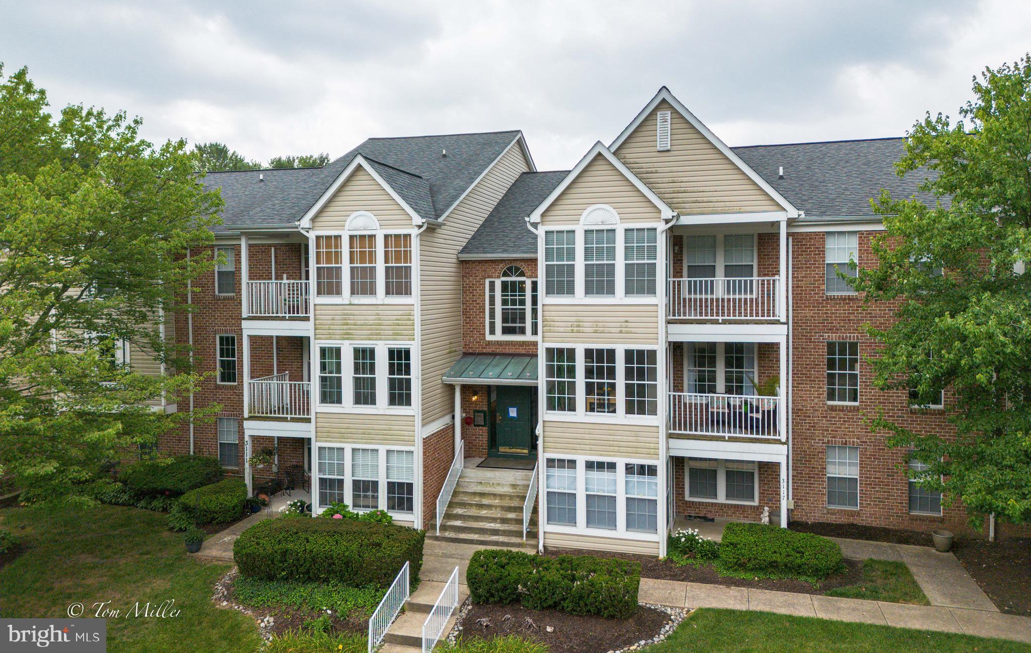 Gorgeous Greenspring East 2 Bed/2 Bath CONDO. This lovely refreshed condo offers comfort, convenience, and contemporary design with an open floor plan. The newly refreshed kitchen features painted cabinetry & hardware, recently installed new flooring and new gorgeous granite countertops. The kitchen has a view to the living room and porch with a breakfast bar with seating for 8. The primary suite offers a tranquil retreat for rest and relaxation, complete with a walk-in closet and an en-suite bathroom featuring  a tile surround shower.  The second bedroom is adjacent to the second bathroom well appointed with a tub/shower with tile surround. Designed with a focus on comfort and convenience, this condo also includes a designated laundry area with storage, ensuring that daily chores are a breeze. The private balcony provides a serene outdoor space, perfect for savoring your morning coffee or enjoying a quiet evening. Residents of Greenspring East enjoy a range of exceptional amenities. The community offers meticulously maintained grounds that invite leisurely strolls.... Additionally, this condo includes easy parking and is conveniently located near the Shops and Restaurants at Quarry Lake and I 695 with access to downtown Baltimore. Schedule a showing today! Your new home awaits!