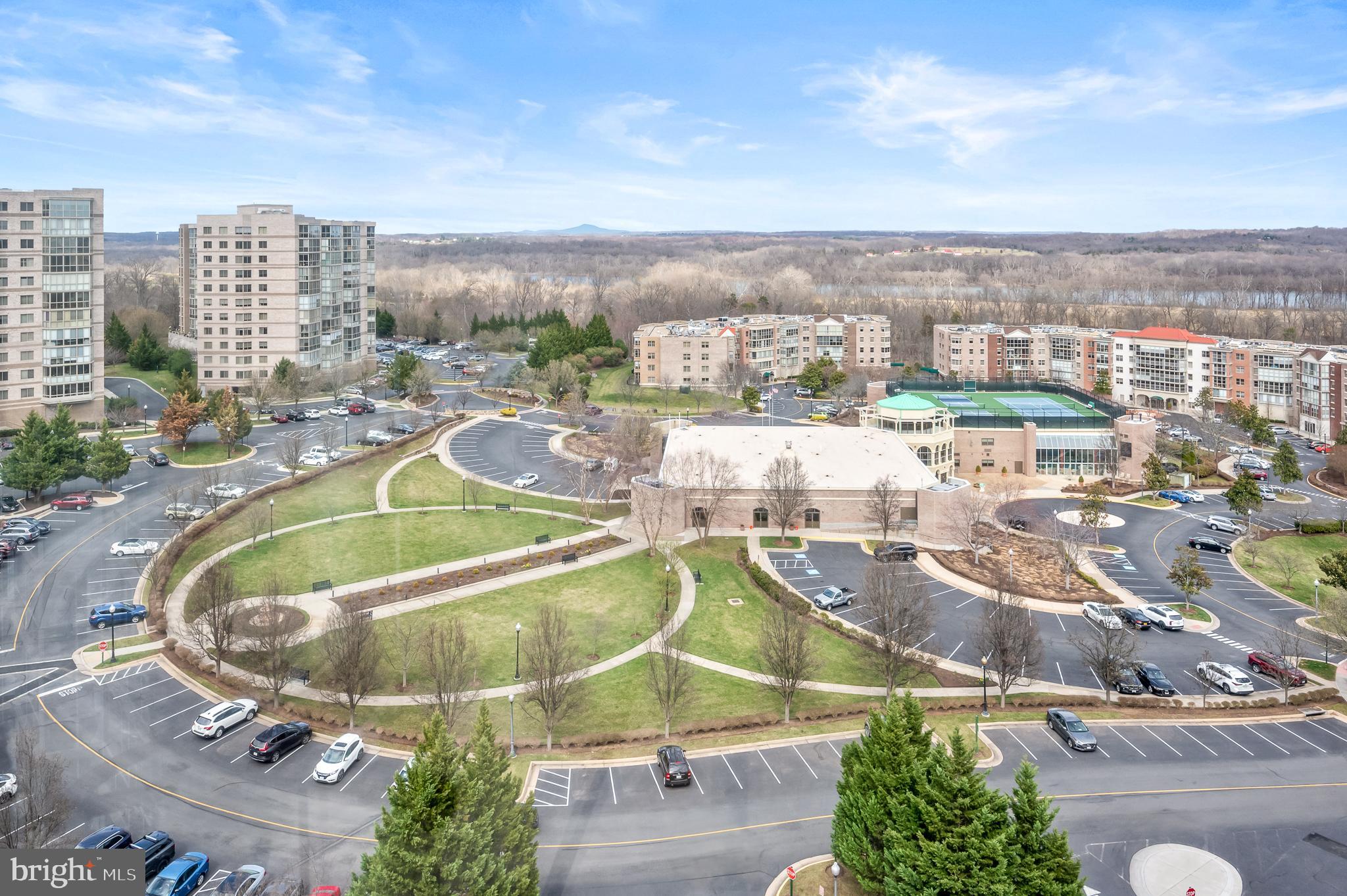 Welcome to a refined living experience at this premier 55+ community. This elegant 874-square-foot residence offers a harmonious blend of comfort and style, perfectly suited for those seeking a serene retreat in a vibrant community.

The panoramic views of trees, river and more await you from the glass enclosed balcony.  Step inside to discover an inviting one-bedroom haven thoughtfully designed with modern conveniences. The spacious eat-in kitchen is a culinary delight complete with tile floors and stainless steel appliances.. The living area flows seamlessly with room for your furnishings and steps out to the balcony.  The primary bedroom features a walk-in closet and ensuite bathroom. 

Indulge in a suite of amenities  within the community designed to enhance your lifestyle. Enjoy year-round relaxation with access to an indoor pool and jacuzzi, or maintain your fitness routine in the well-equipped gym. For leisure, explore the billiards room or engage in friendly competition on the tennis/pickleball court. The clubhouse offers additional recreational options such as woodworking, ceramics, theatre, art studio, library and more , ensuring there’s something for everyone.  Join a club, garden in your own plot, step out on the trails - all within this fenced community.

This bright  unit is equipped with a washer/dryer, central air conditioning, stainless steel appliances updated in 2018, new A/C unit in 2024.   A storage unit and an elevator add to the ease of living in this relaxing environment.  Don’t miss the opportunity to make this exceptional residence your new home.
