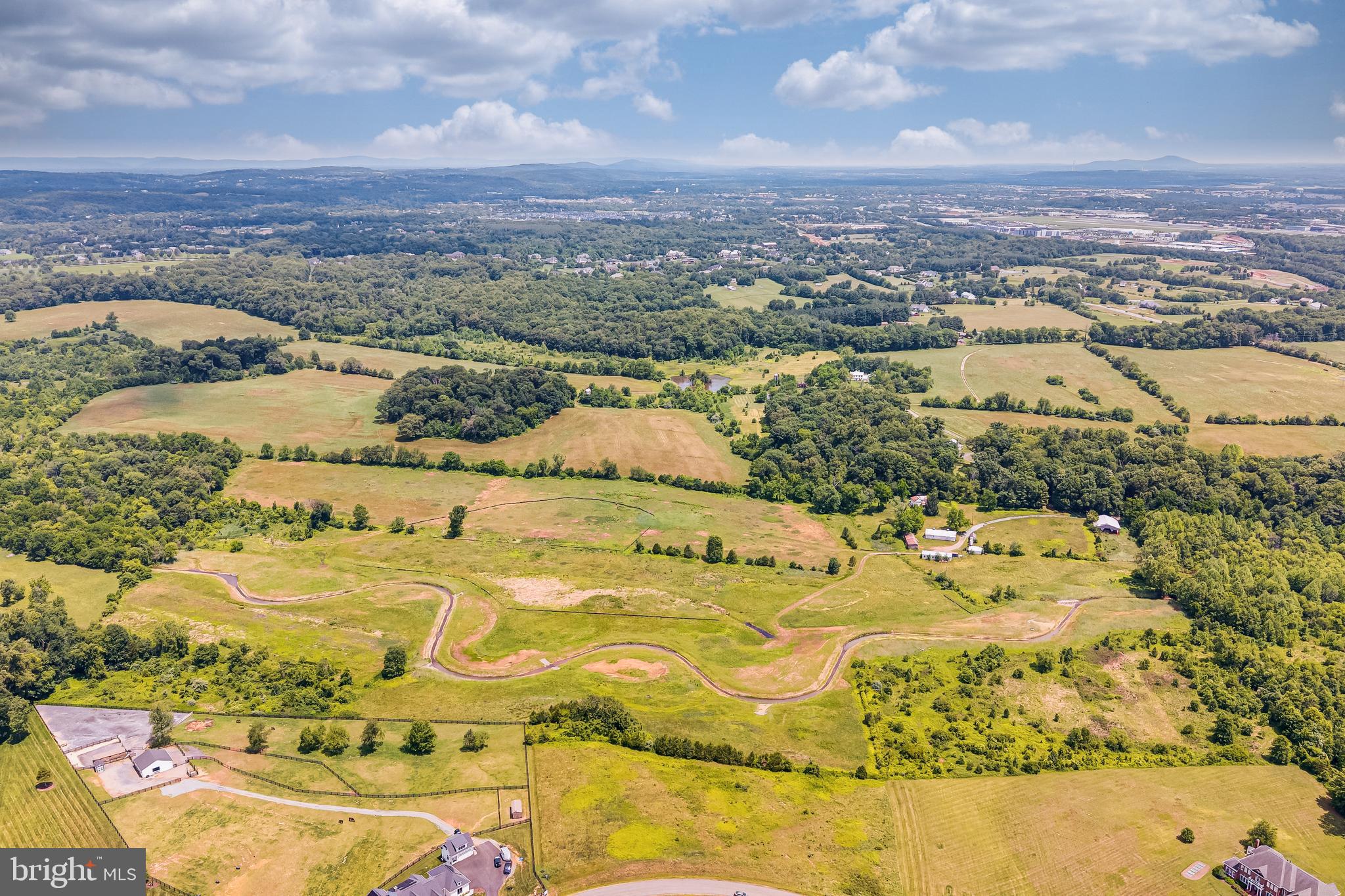 An extraordinary opportunity to acquire over 46 acres of breathtaking countryside in one of Loudoun County's most sought-after locations. Tucked just off Evergreen Mills Road, this exceptional property is graced by the meandering waters of Sycolin Creek, picturesque stands of mature hardwoods, rolling pastures, and two approved building sites—creating an idyllic setting for a custom estate or equestrian retreat.

For those seeking a legacy property, the two adjoining parcels, also available for purchase separately, present the rare opportunity to create an expansive family compound spanning more than 50 acres.

Perfectly positioned just minutes from Brambleton, the Dulles Toll Road, historic downtown Leesburg, top-rated schools, premier shopping, Hal & Bernie Hanson Regional Park, acclaimed wineries, and local breweries, this remarkable property offers the ideal balance of accessibility and seclusion. A place where natural beauty, privacy, and enduring tranquility come together to create an unparalleled Virginia countryside lifestyle.
Tax bill will be updated soon.